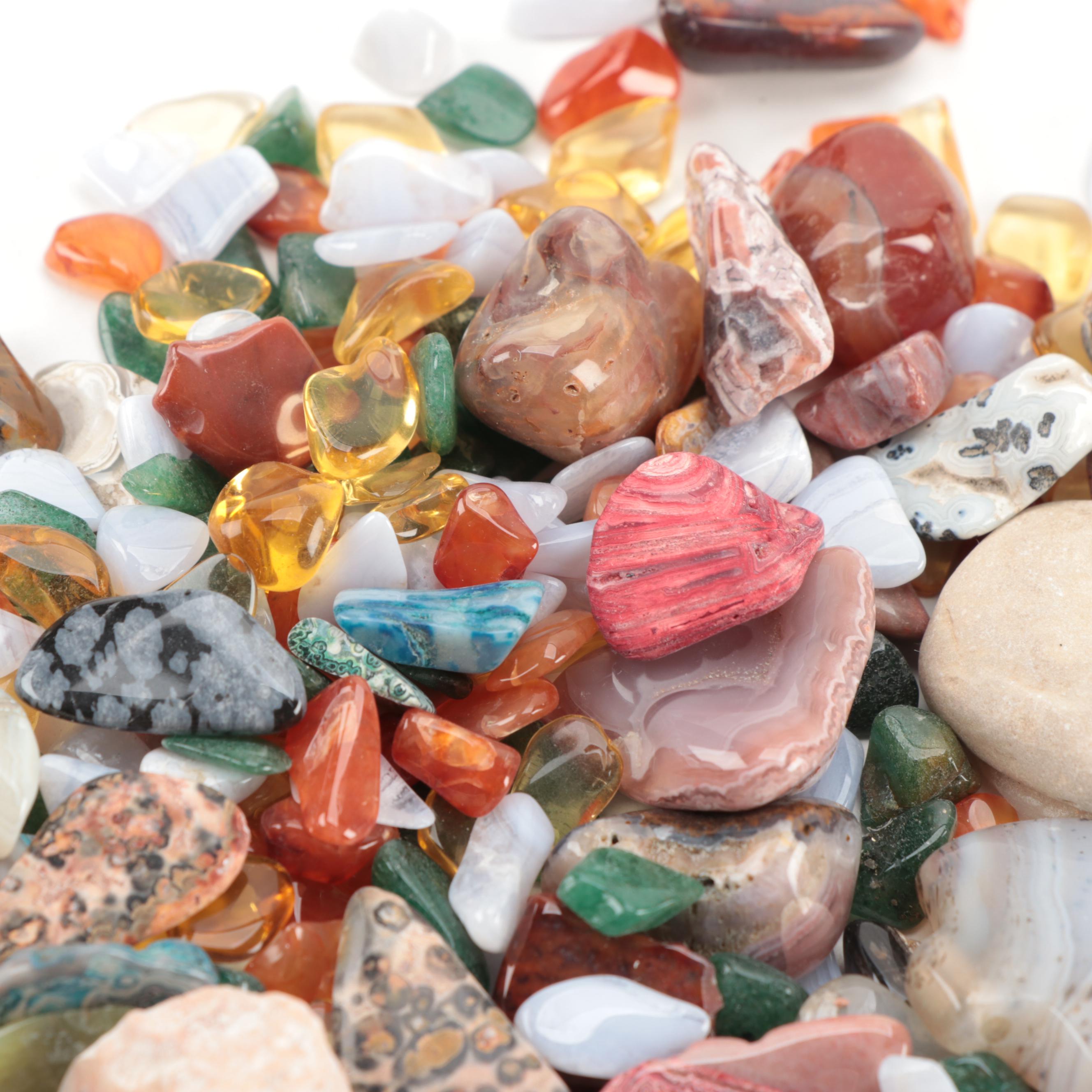 Polished and Rough Gemstones Including Tiger's Eye, Turquoise, Jasper, and More