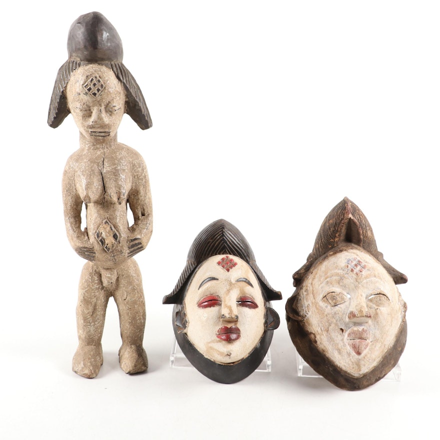 Punu Style Carved Masks and Female Figure, Central Africa
