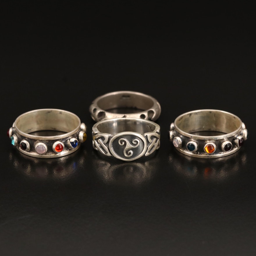 Sterling Rings Including Celtic Triskelion, Glass and Scrolling Band