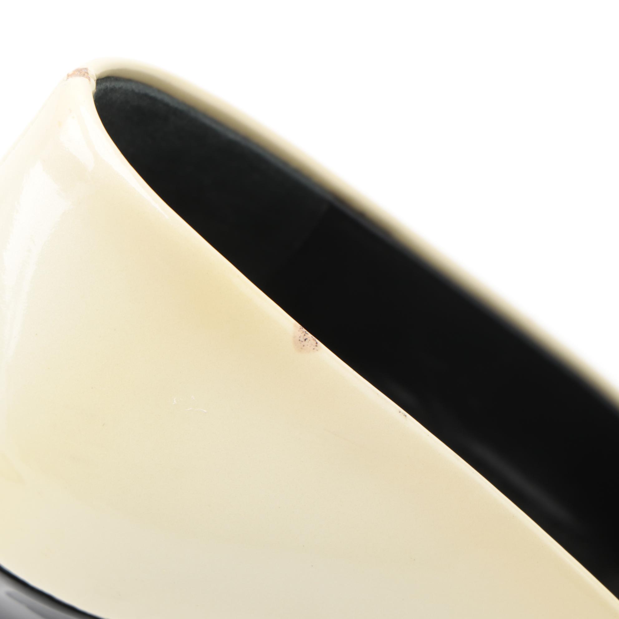 Prada Black and Pearlized Ivory Patent Leather Pumps