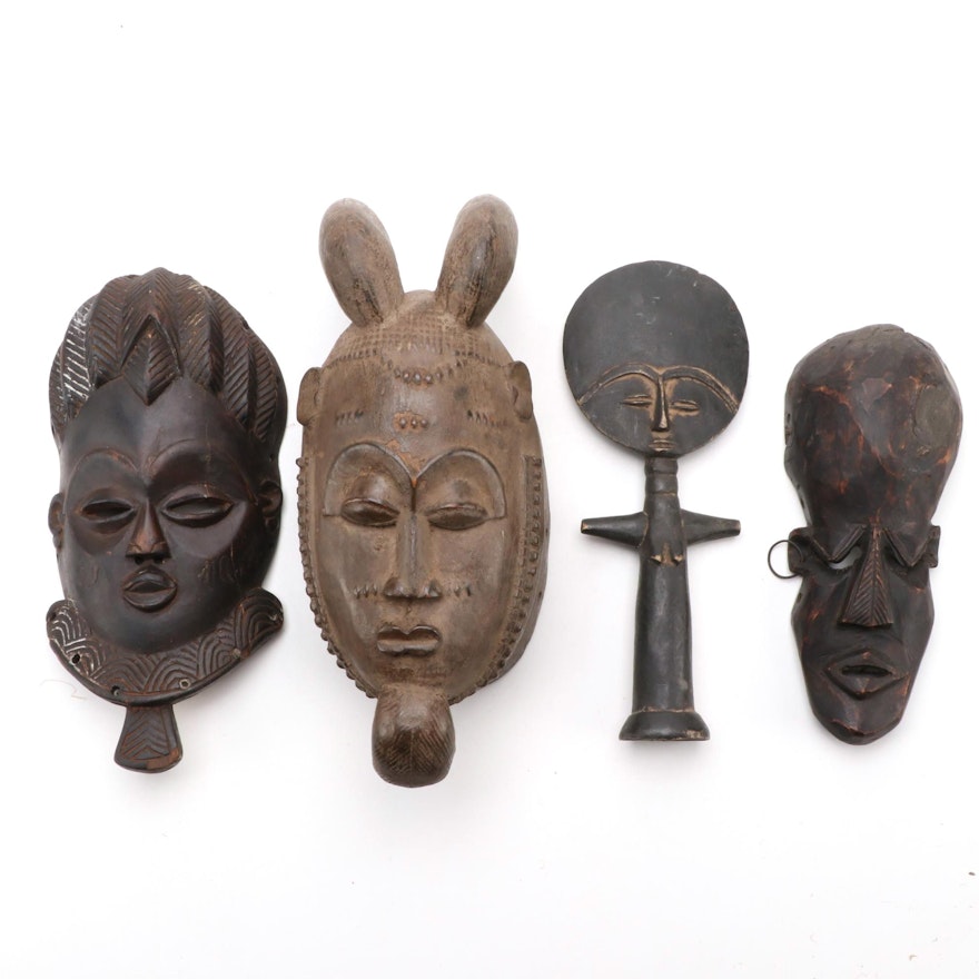 West African Hand-Carved Wooden Masks and Figurine