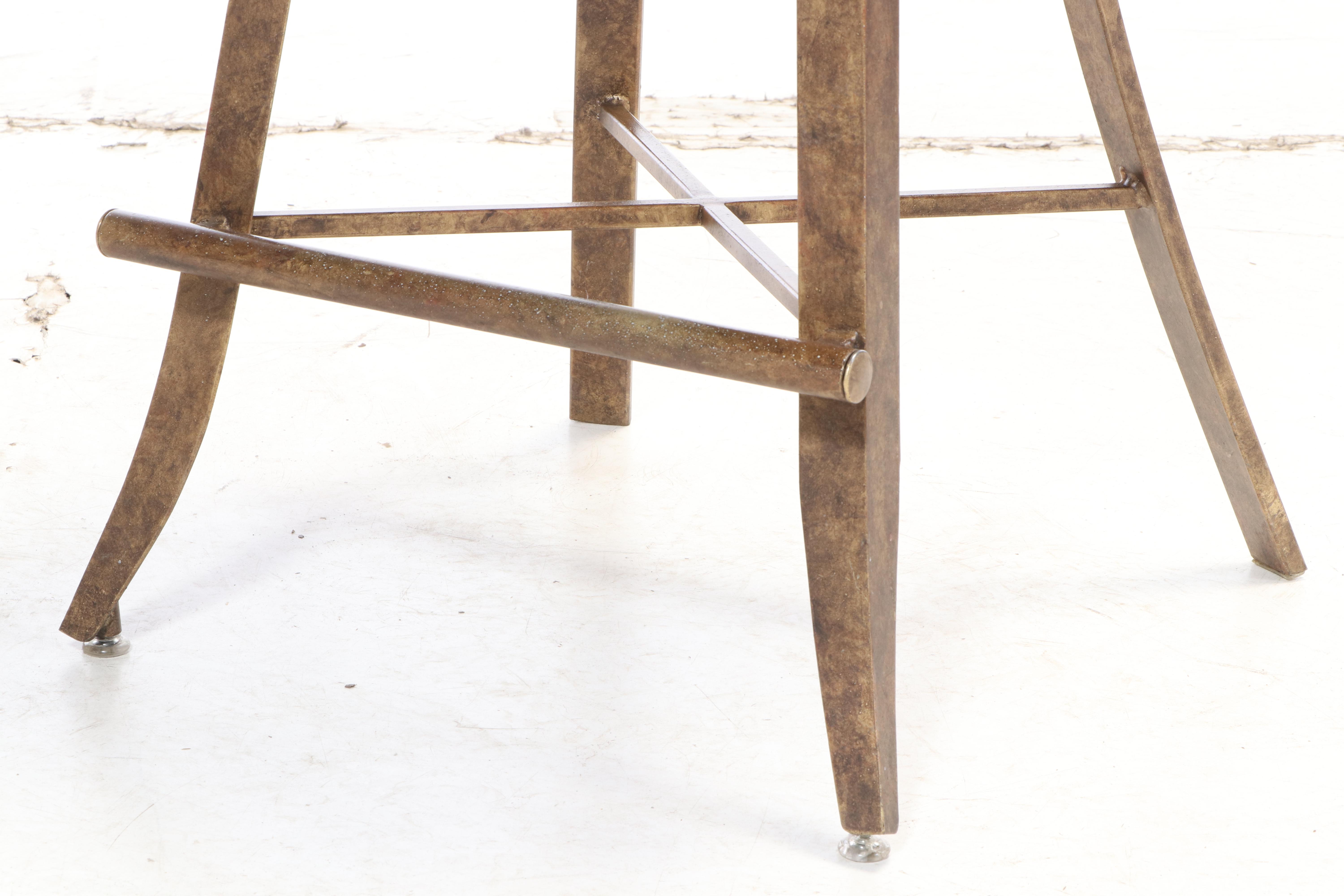 Three Kessler Industries Patinated Metal Counter-Height Swivel Bar Stools