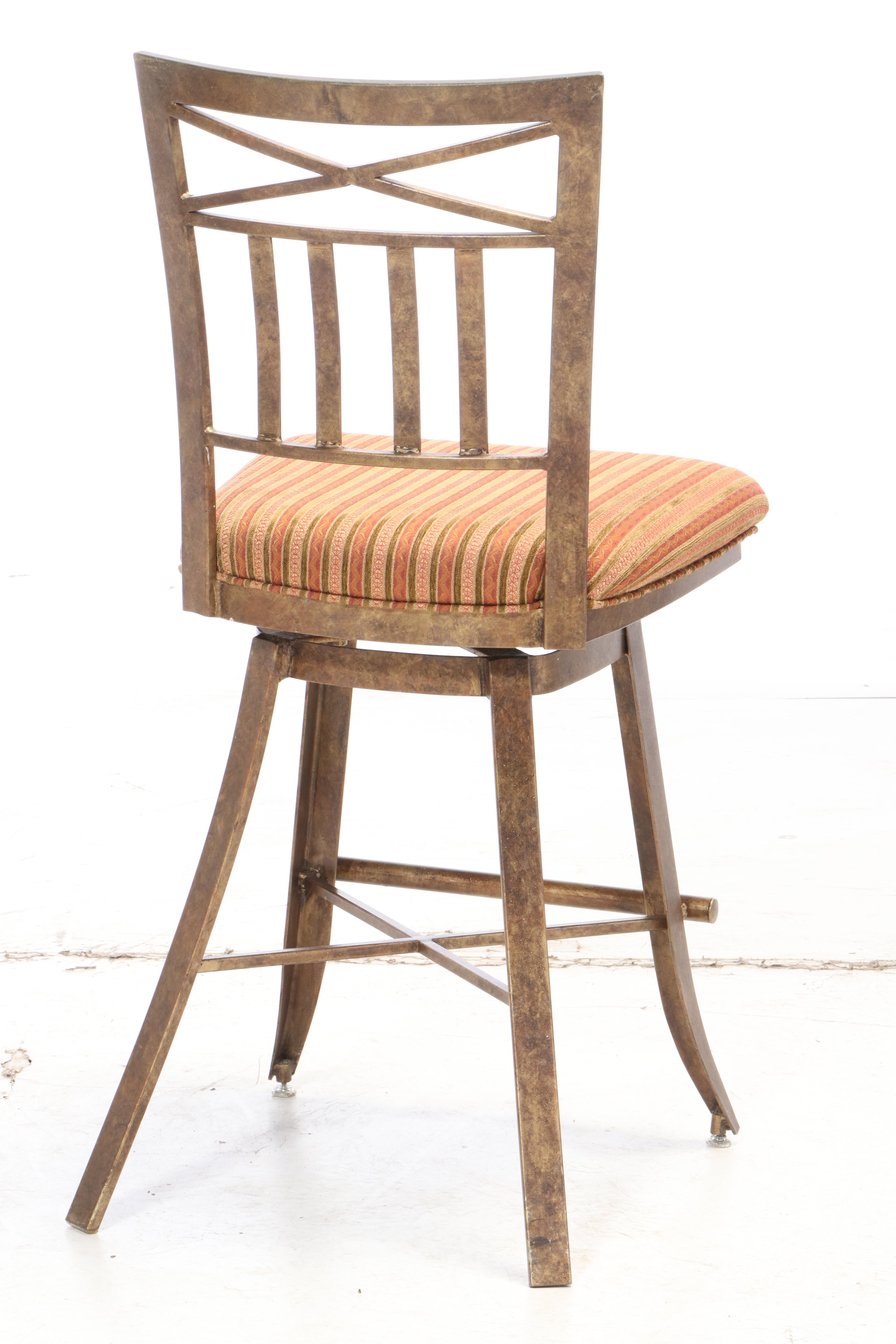 Three Kessler Industries Patinated Metal Counter-Height Swivel Bar Stools