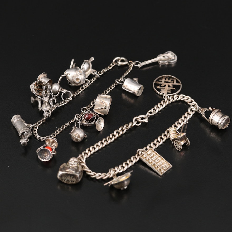 Sterling Charm Bracelets Including Gas Mask and Laughing Buddha Charms