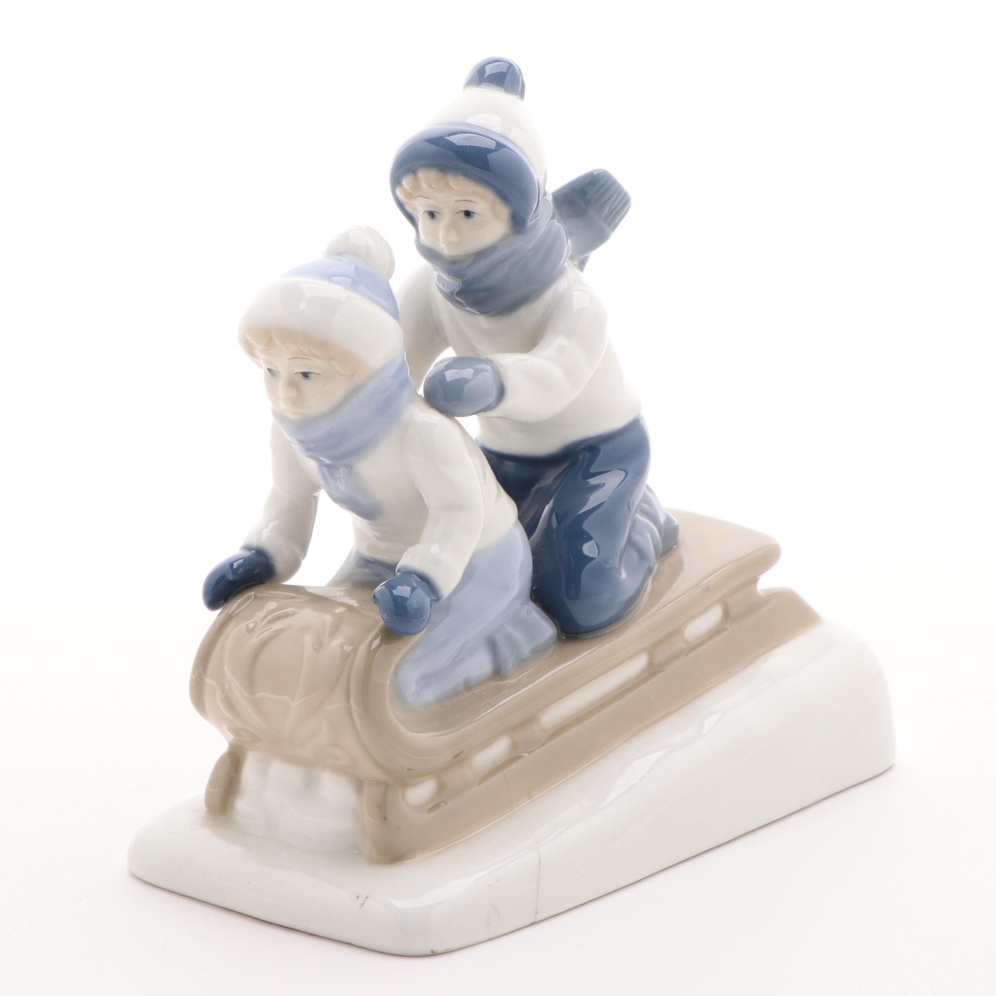 Paul Sebastian Porcelain Sledding Figurine, Late 20th Century