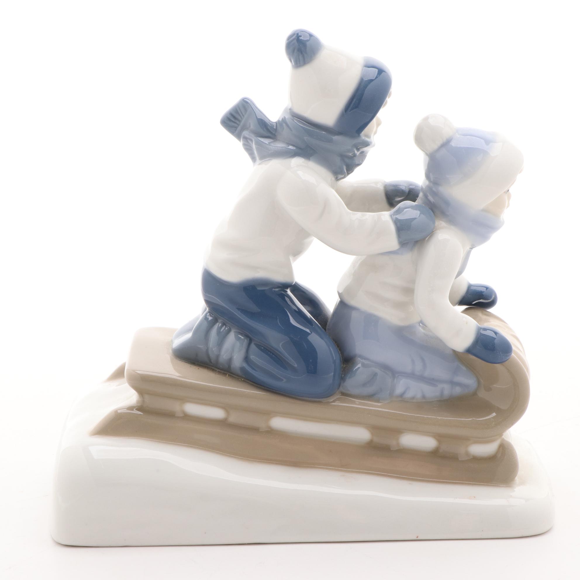 Paul Sebastian Porcelain Sledding Figurine, Late 20th Century
