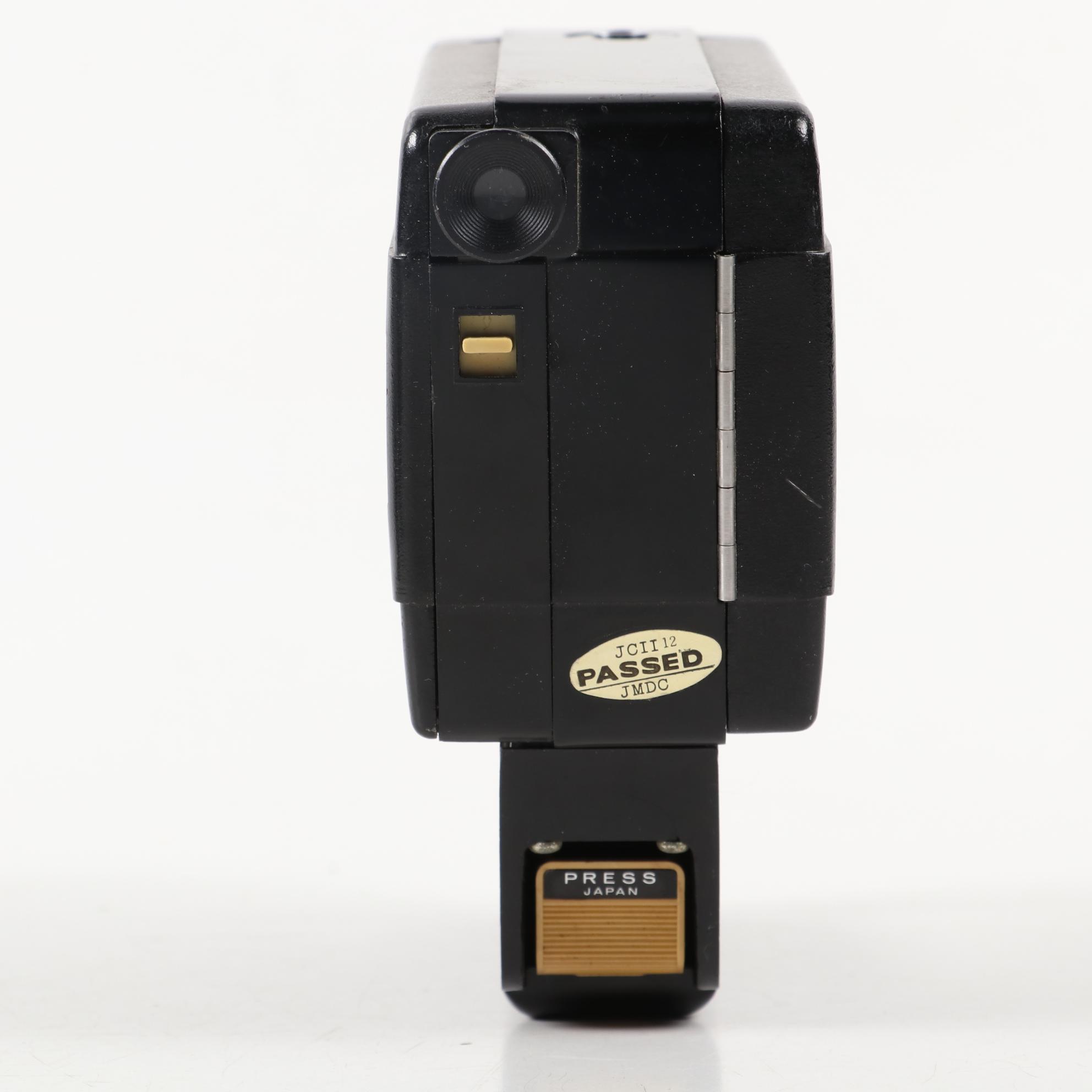 "Moviematic" and "TLX Electric Eye" Movie Cameras with "Sun Gun" Movie Light