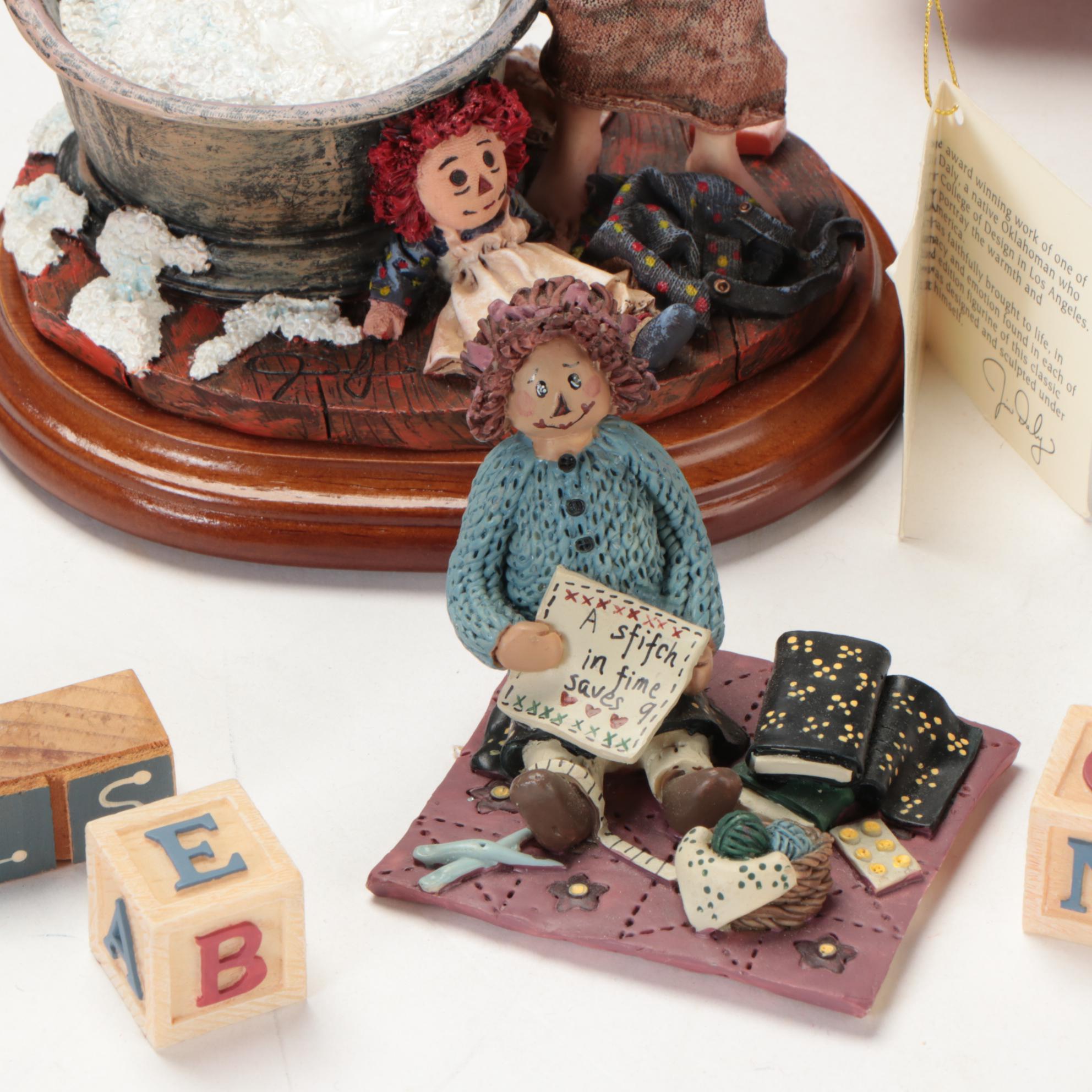 Enesco and Other Raggedy Ann & Andy Figurines with Display Shelves