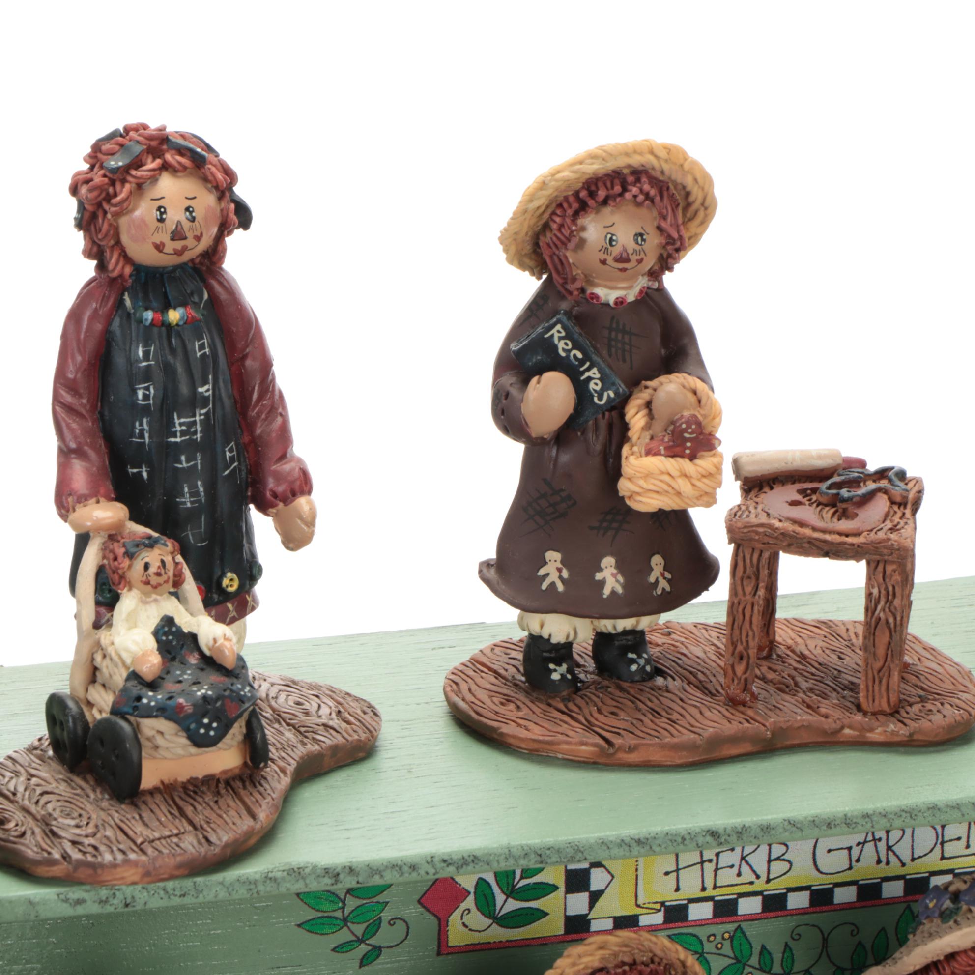 Enesco and Other Raggedy Ann & Andy Figurines with Display Shelves