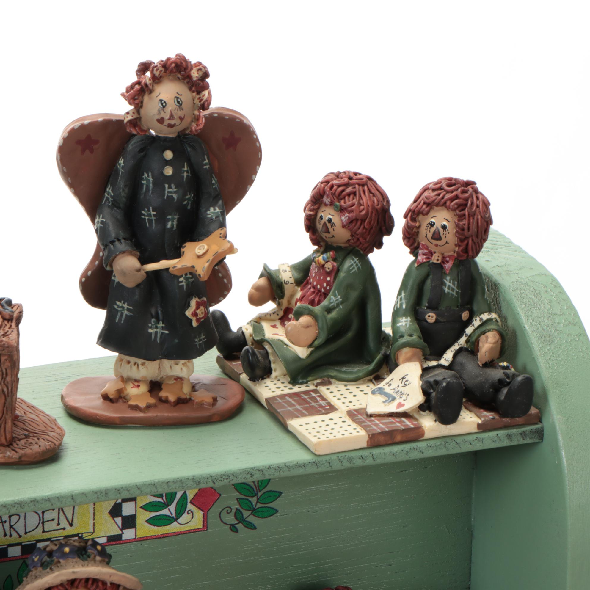 Enesco and Other Raggedy Ann & Andy Figurines with Display Shelves