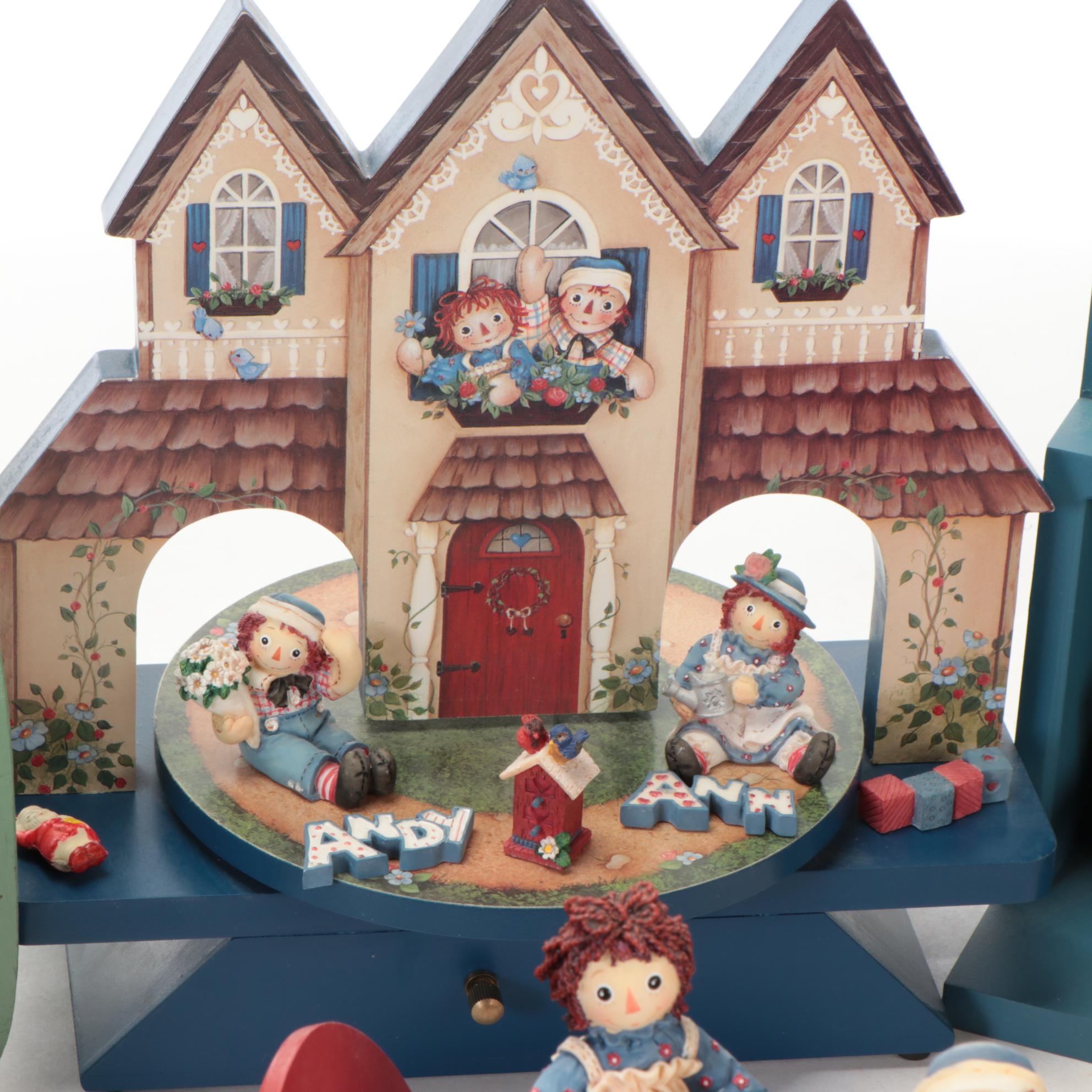Enesco and Other Raggedy Ann & Andy Figurines with Display Shelves