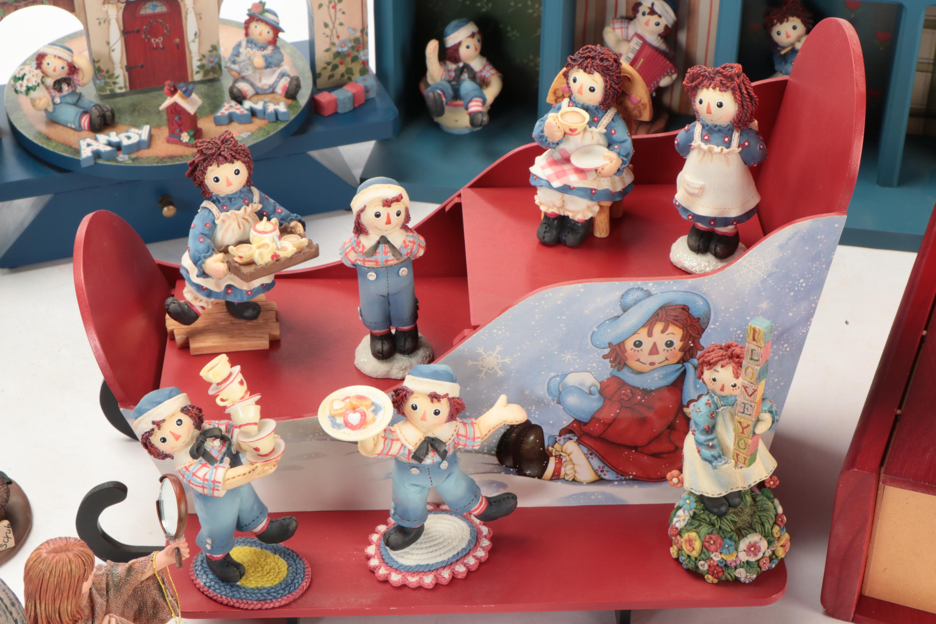 Enesco and Other Raggedy Ann & Andy Figurines with Display Shelves