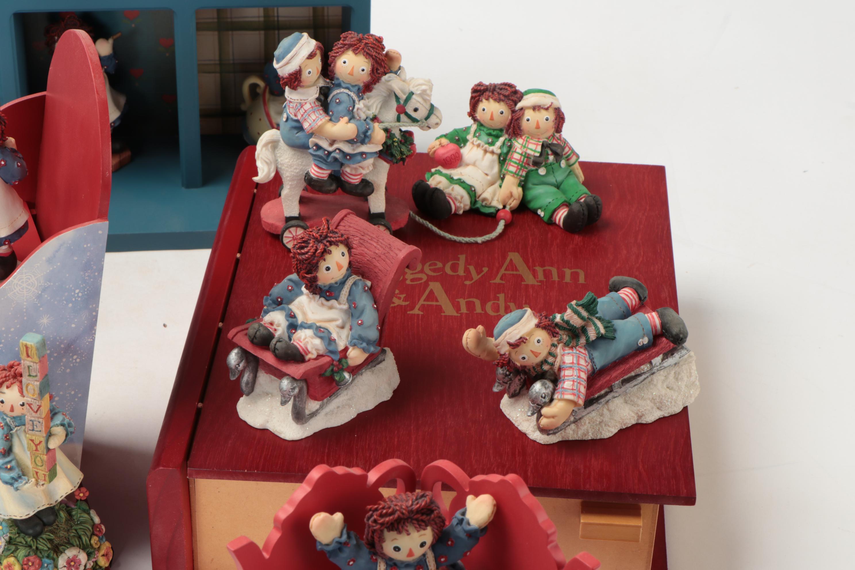 Enesco and Other Raggedy Ann & Andy Figurines with Display Shelves