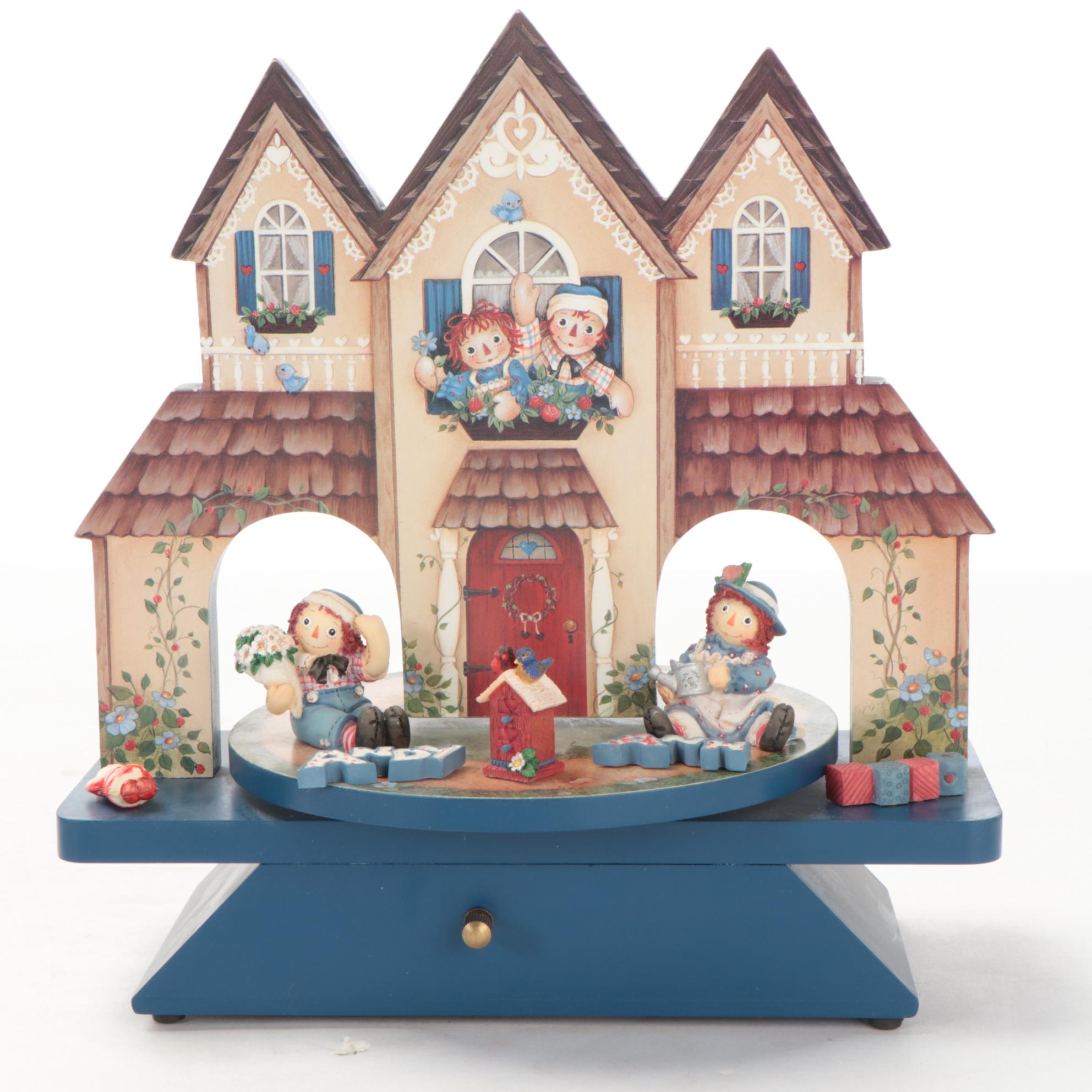 Enesco and Other Raggedy Ann & Andy Figurines with Display Shelves