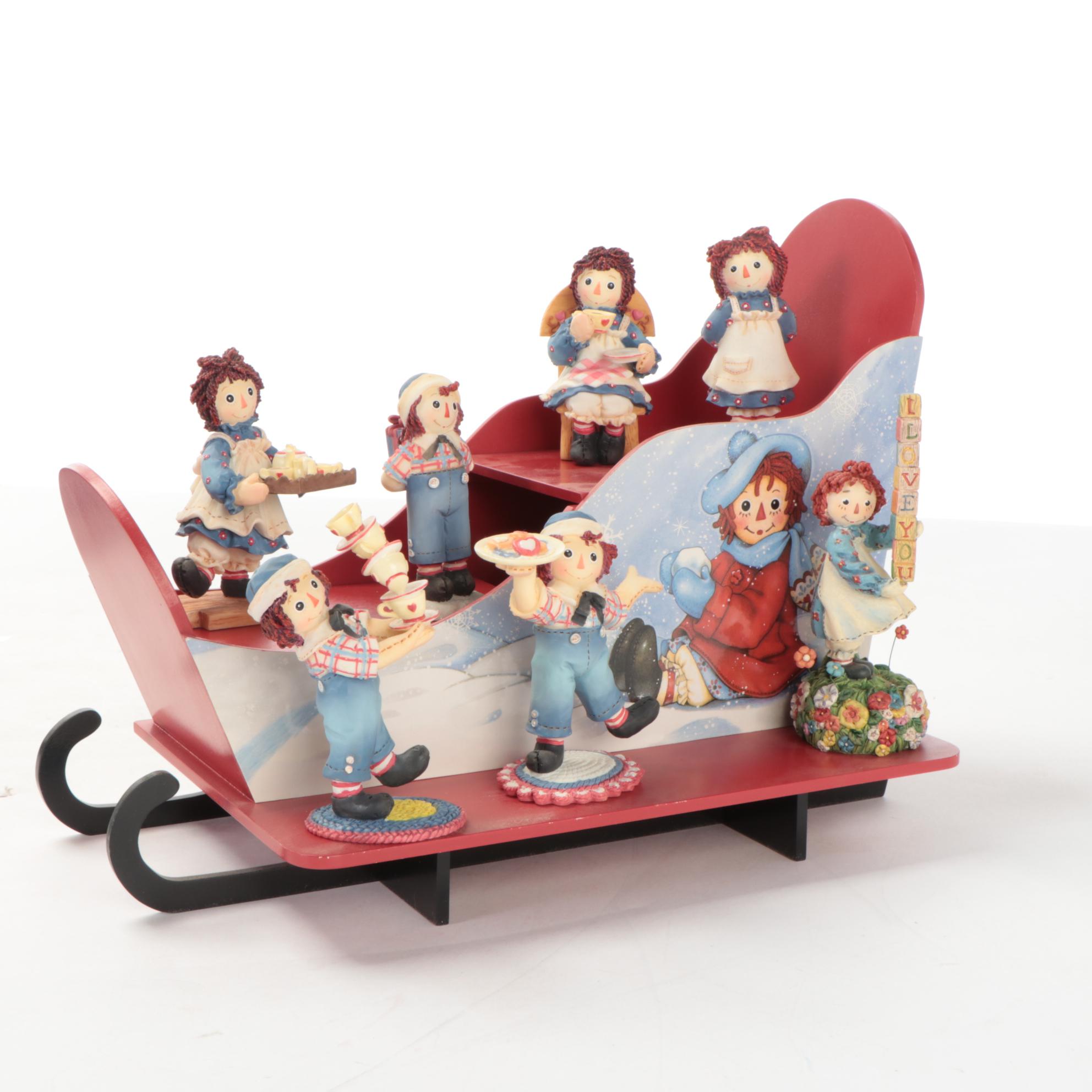 Enesco and Other Raggedy Ann & Andy Figurines with Display Shelves