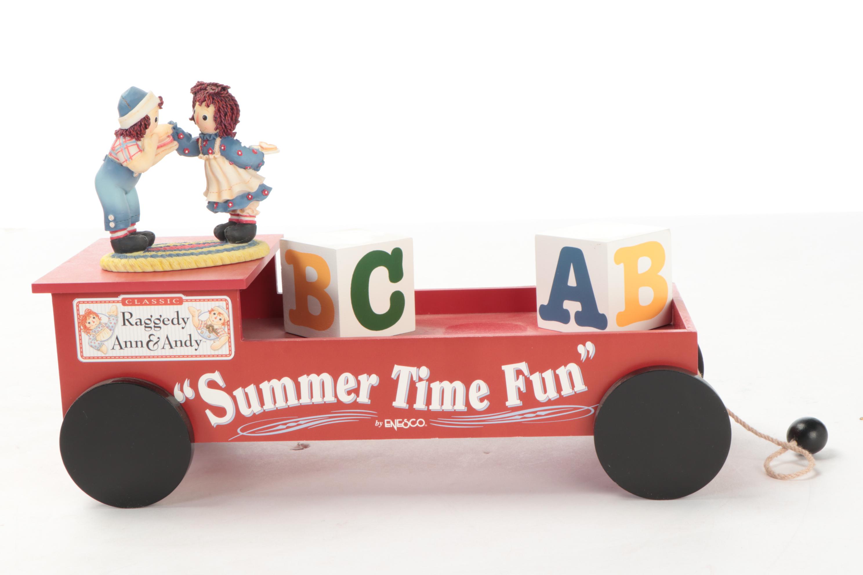 Enesco and Other Raggedy Ann & Andy Figurines with Display Shelves