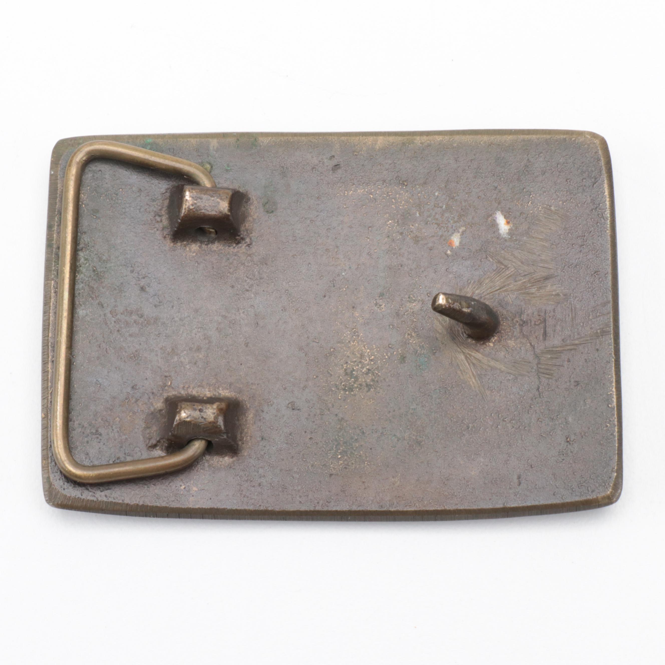 Corn Craftsman, Benchmark Bourbon and Levi Garrett Metal Belt Buckles