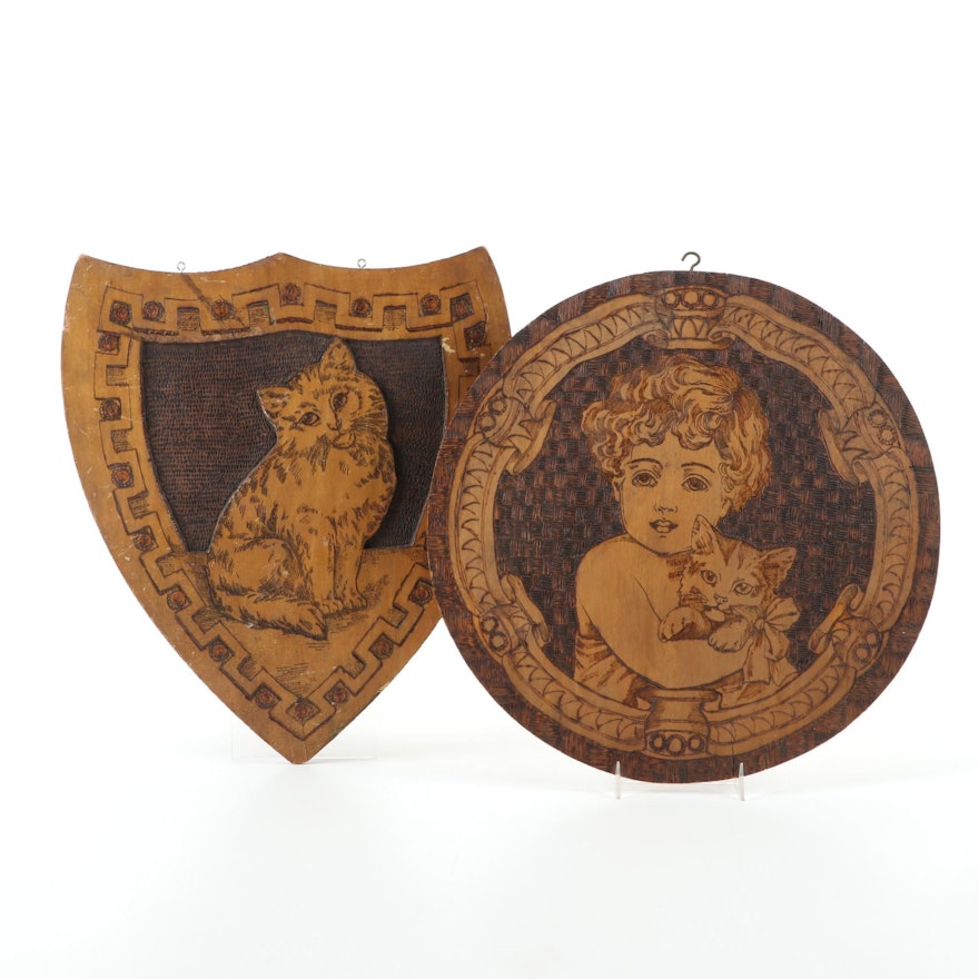 Flemish Art Co. Pyrographic Wall Plaques of a Cat, and a Child Holding a Kitten