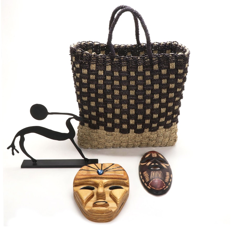 Carved Wood Tribal Masks, Metal Sculpture, and Woven Jute Bag