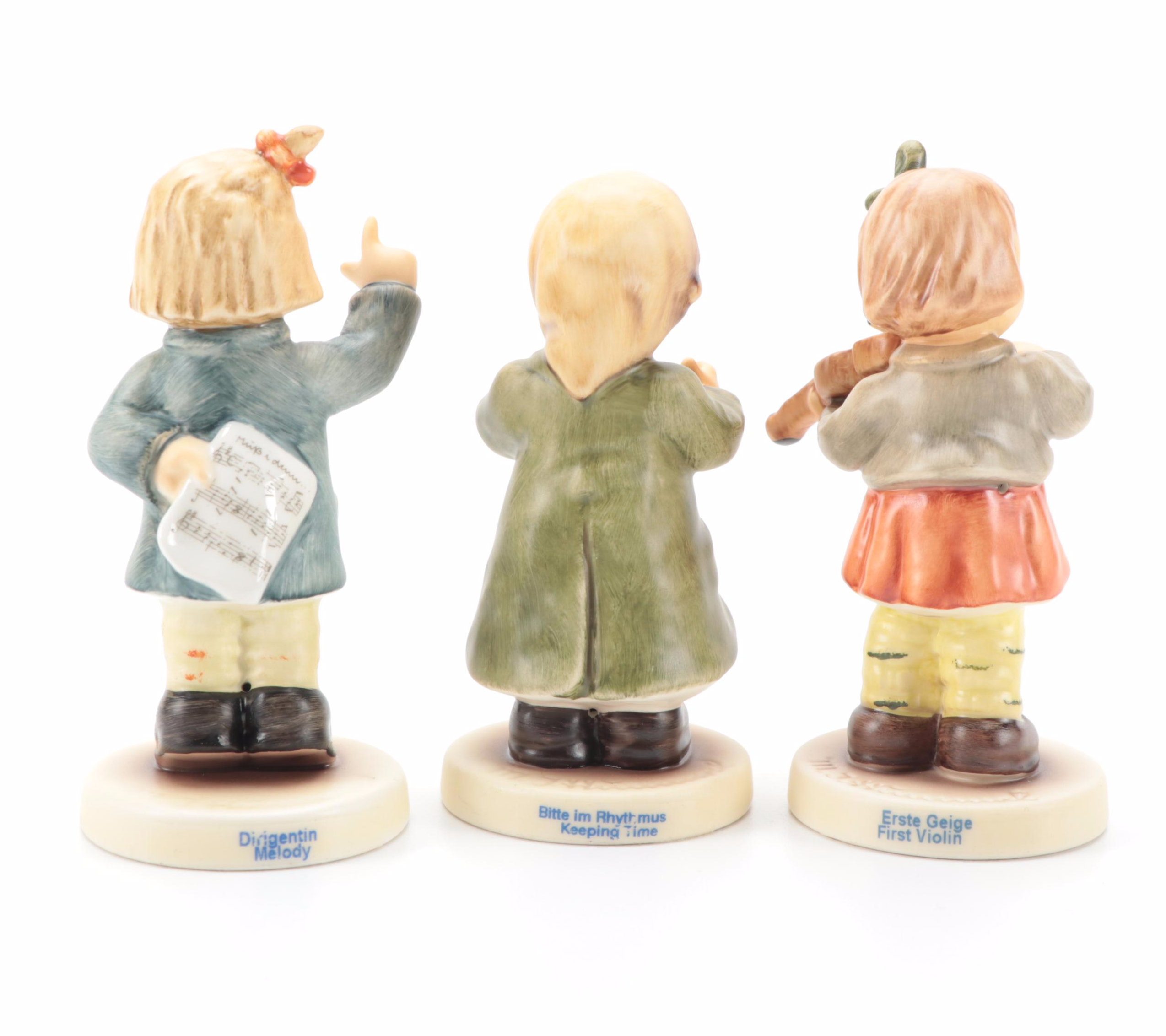 Goebel "Lamplight Caroler" with Other Singer and Musician Porcelain Figurines
