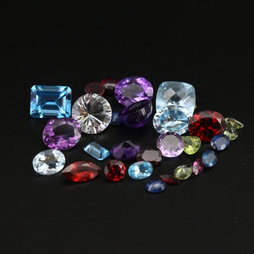 Loose 39.90 CTW Mixed Gemstones Including Amethyst, Sapphire and Peridot