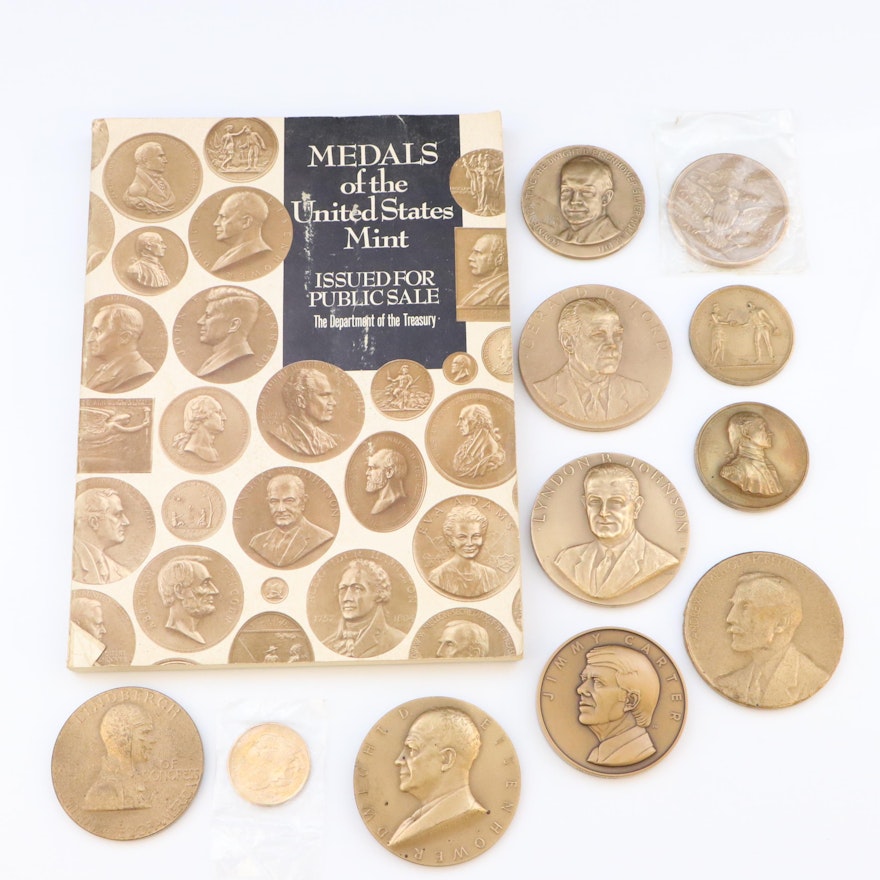 Eleven Commemorative Bronze Medals and U.S. Mint Medals Reference Book