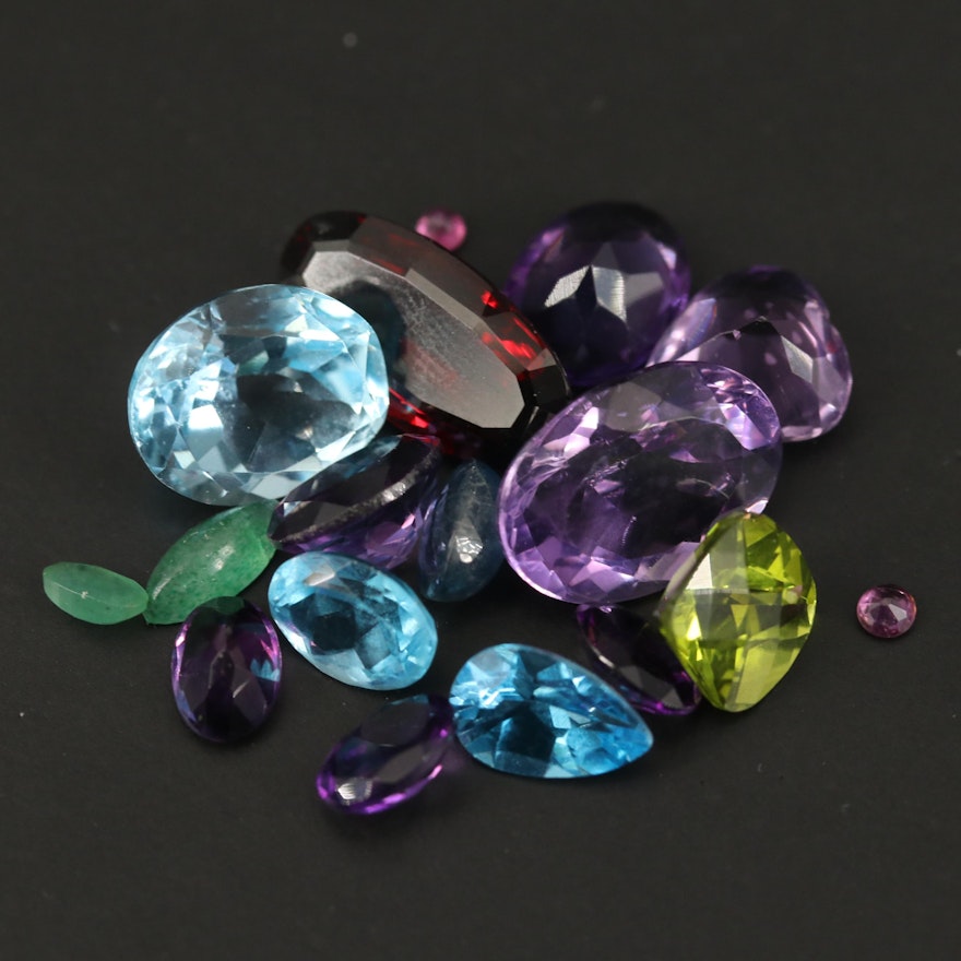 Loose 33.81 CTW Mixed Gemstones Including Amethyst, Garnet and Swiss Blue Topaz