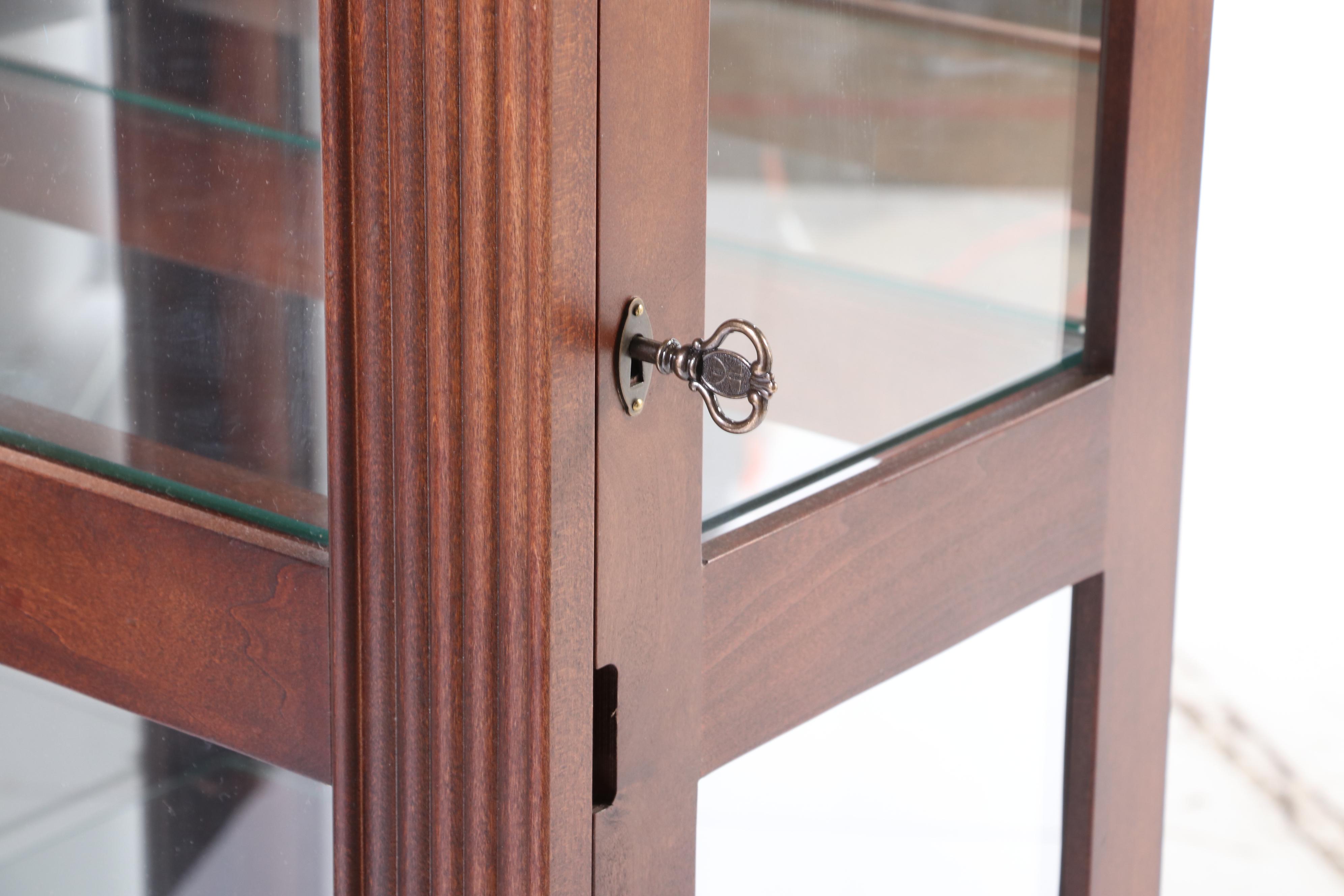 Howard Miller Cherrywood-Stained Mirror-Back Display Cabinet