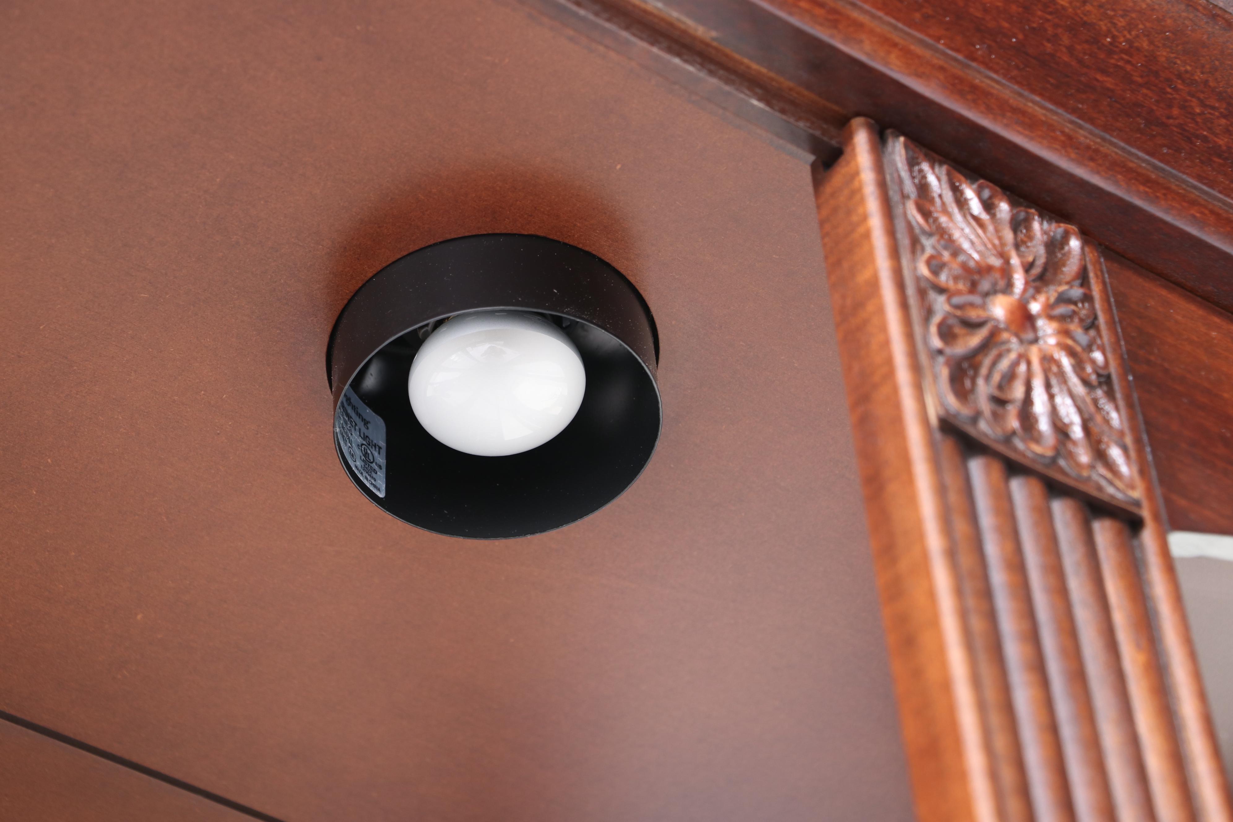 Howard Miller Cherrywood-Stained Mirror-Back Display Cabinet