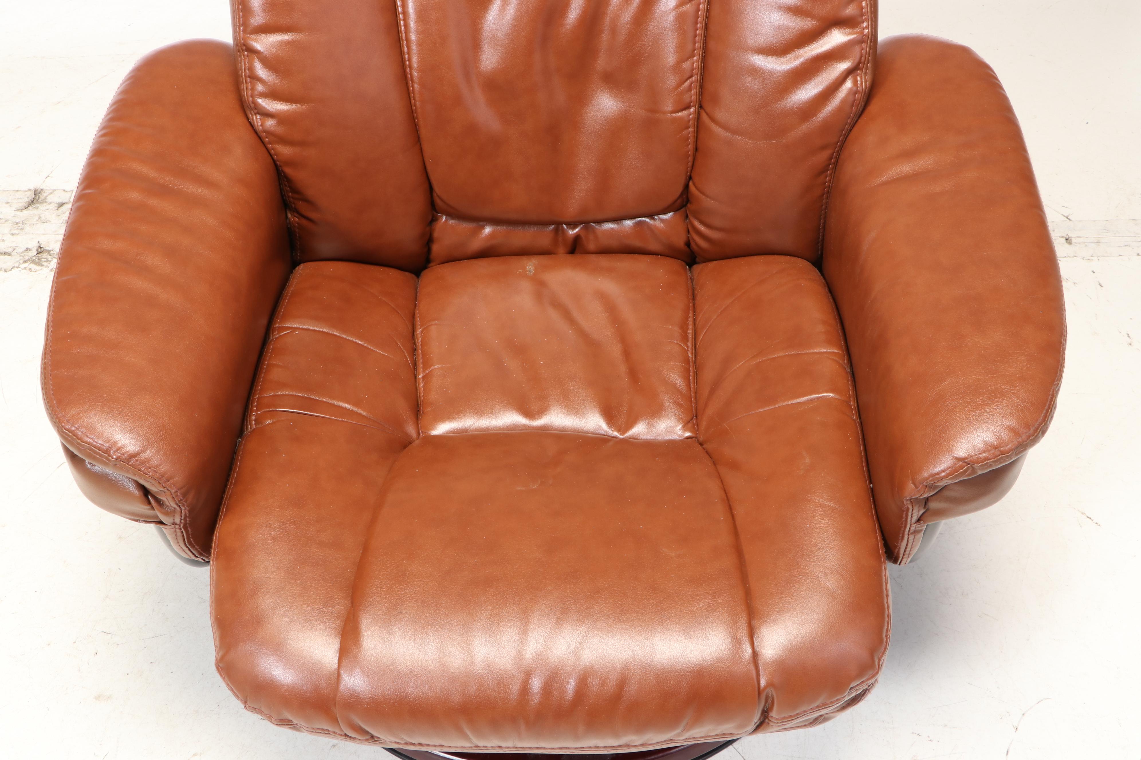 Belnick Inc. Faux-Leather Swivel Recliner and Ottoman