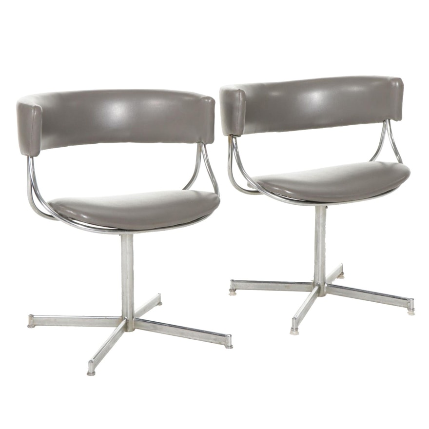 Pair of Mid Century Modern Chrome and Faux Leather Swivel Chairs