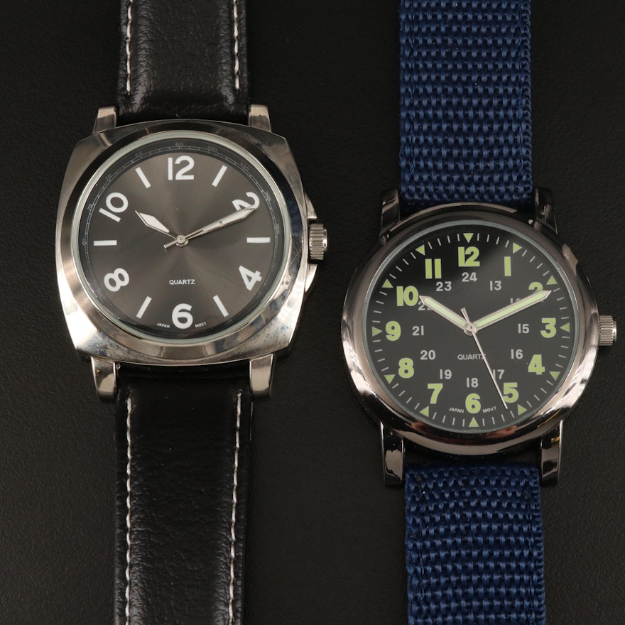 A Pair of White and Black Tone Quartz Wristwatches