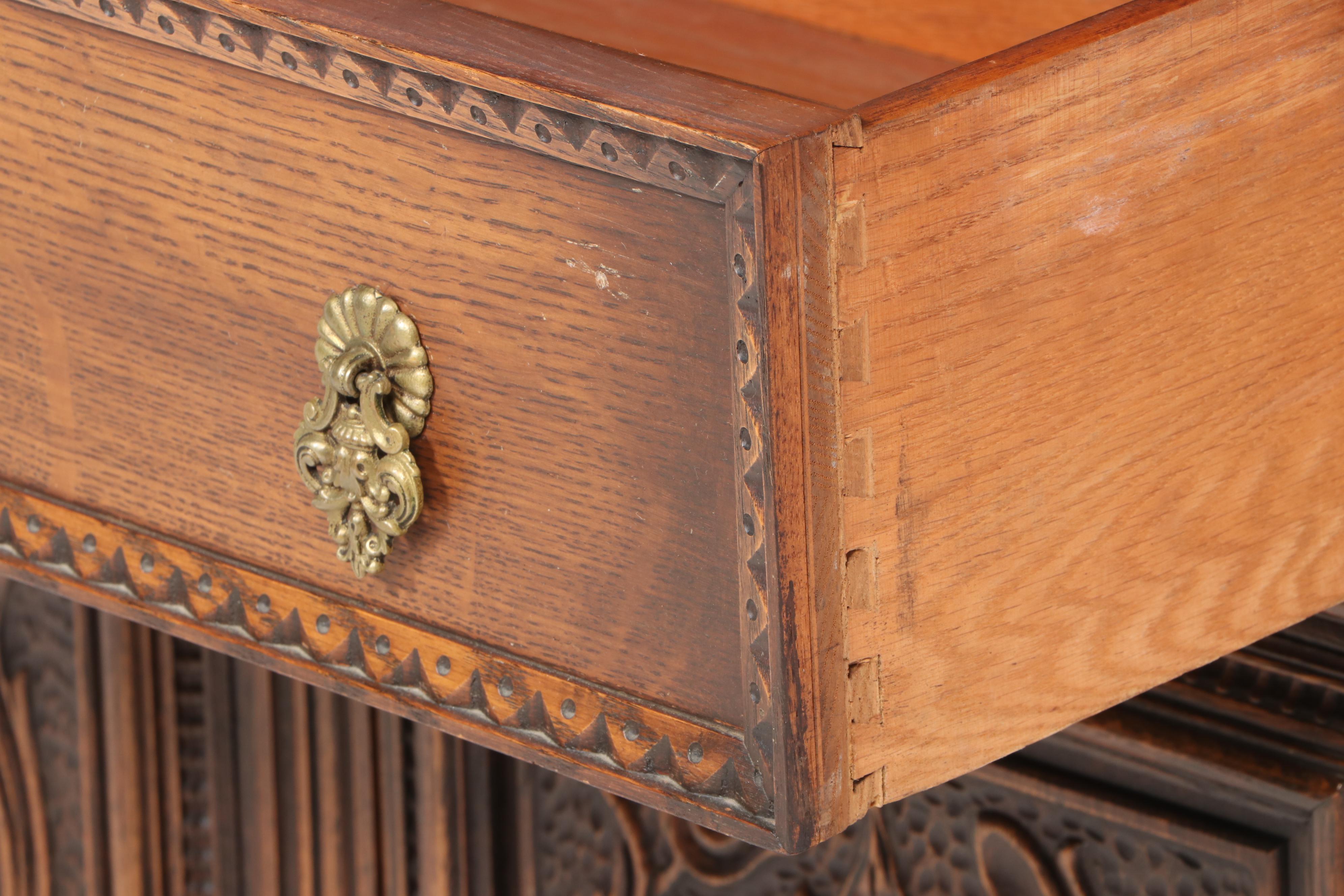Jacobean Style Relief-Carved Oak China Cupboard, Early to Mid 20th Century