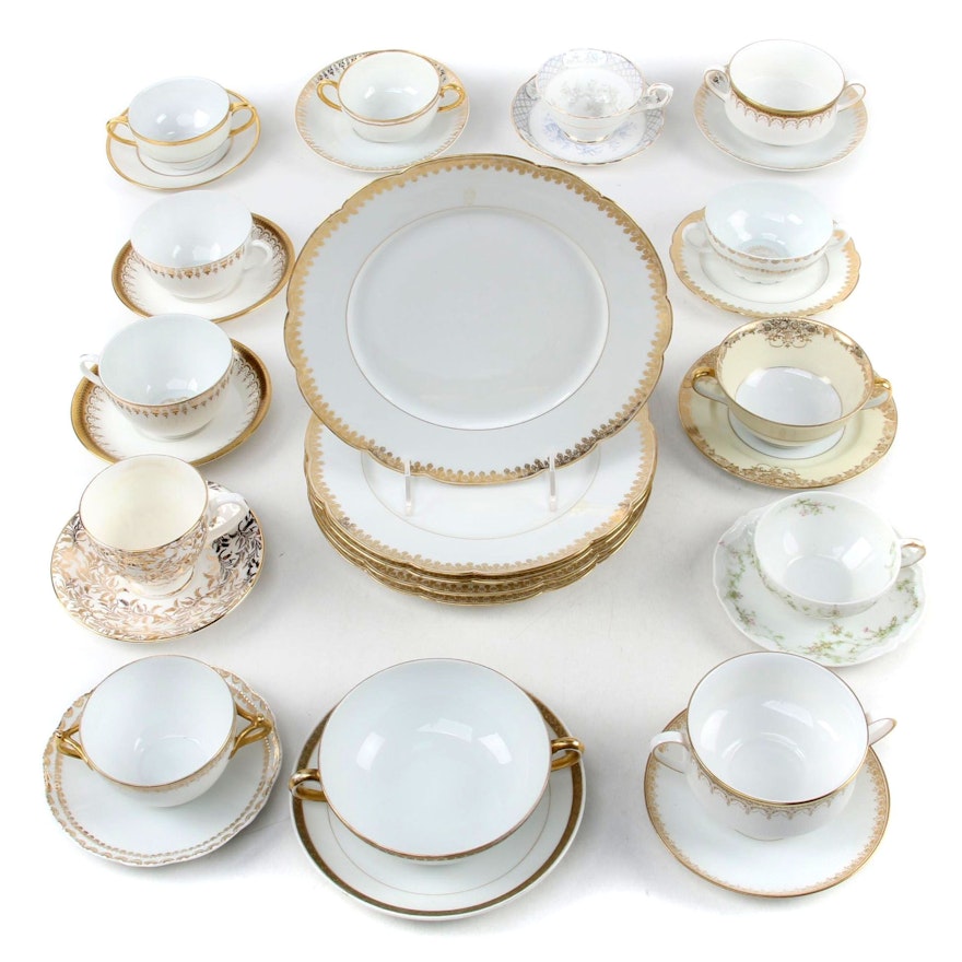 Tressemann & Vogt Plates with Assorted Gilt and White Porcelain Serveware