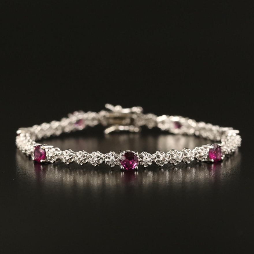 Sterling Topaz Line Bracelet with Rhodolite Garnet Accents