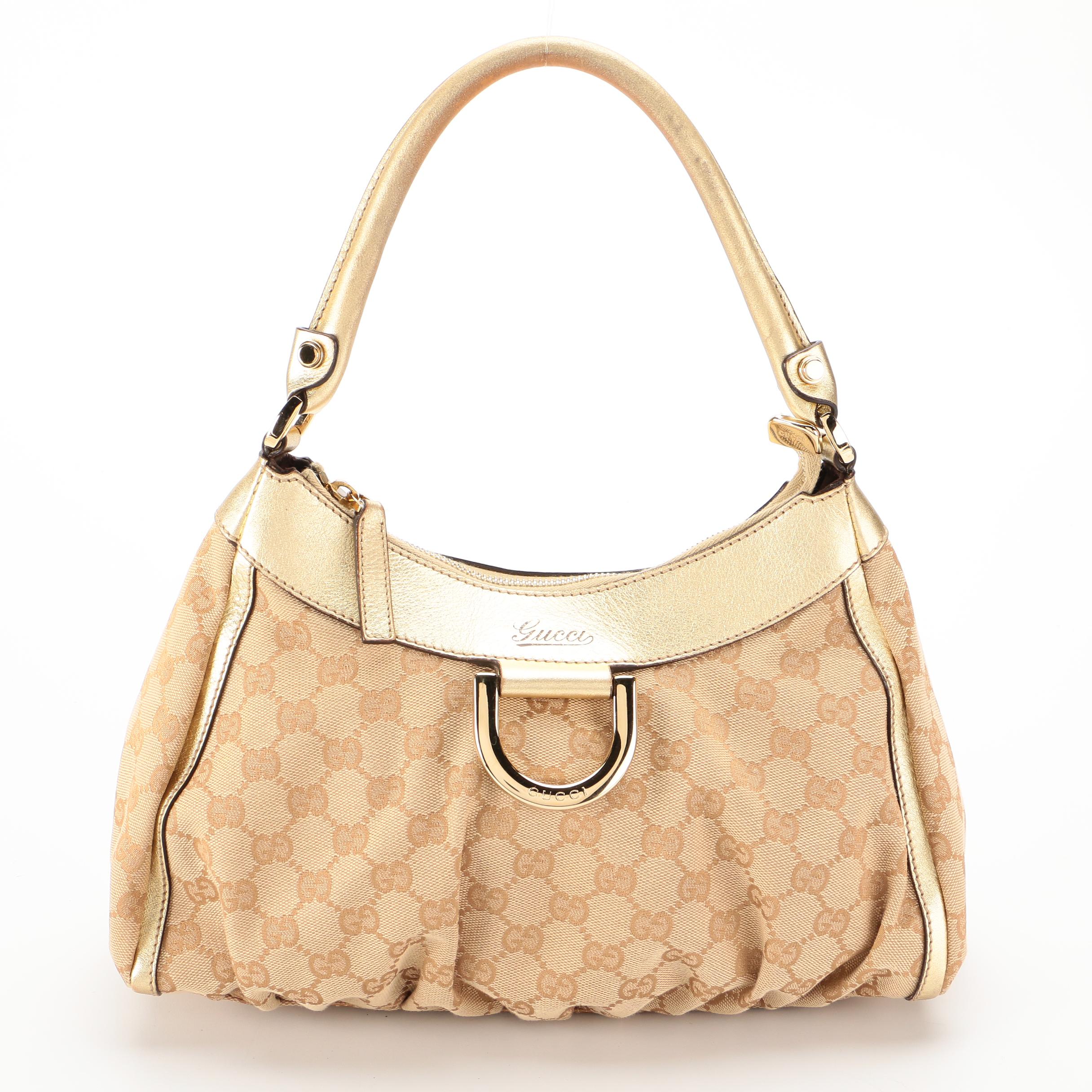 Gucci Abbey D-Ring Hobo Bag in GG Canvas and Gold Metallic Leather