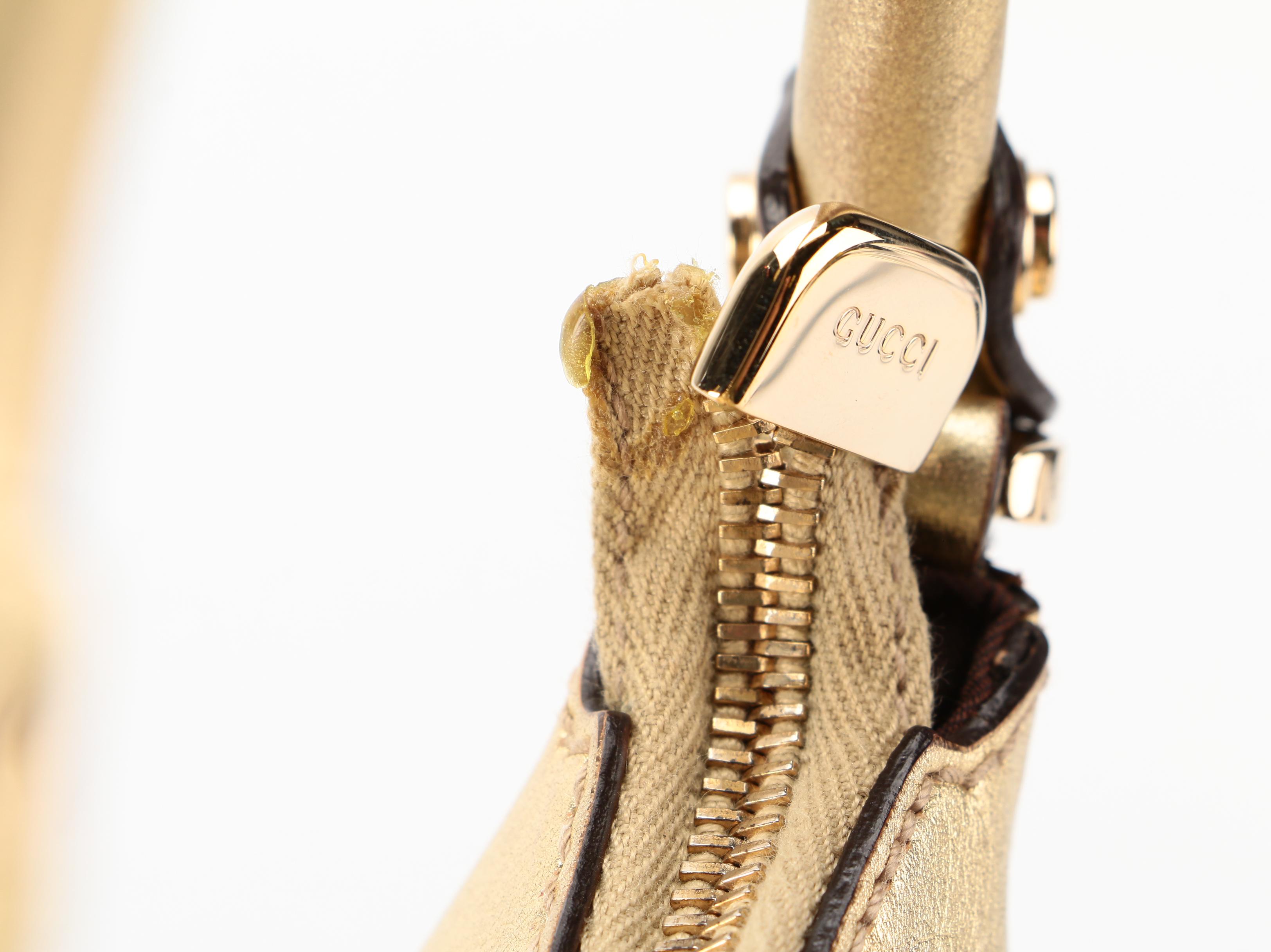 Gucci Abbey D-Ring Hobo Bag in GG Canvas and Gold Metallic Leather