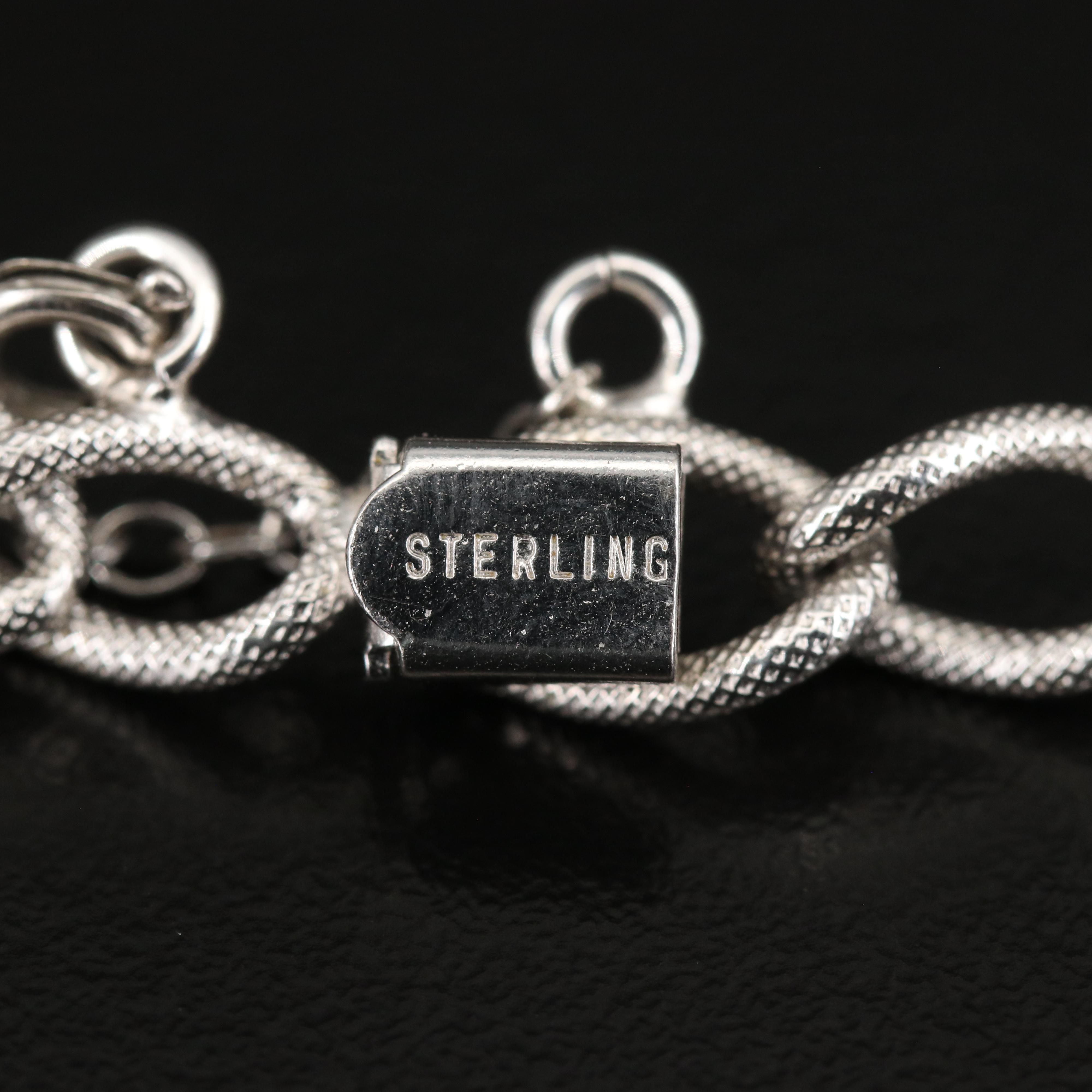 Sterling Charm Bracelet with Horse, Trolley and Abacus Charms
