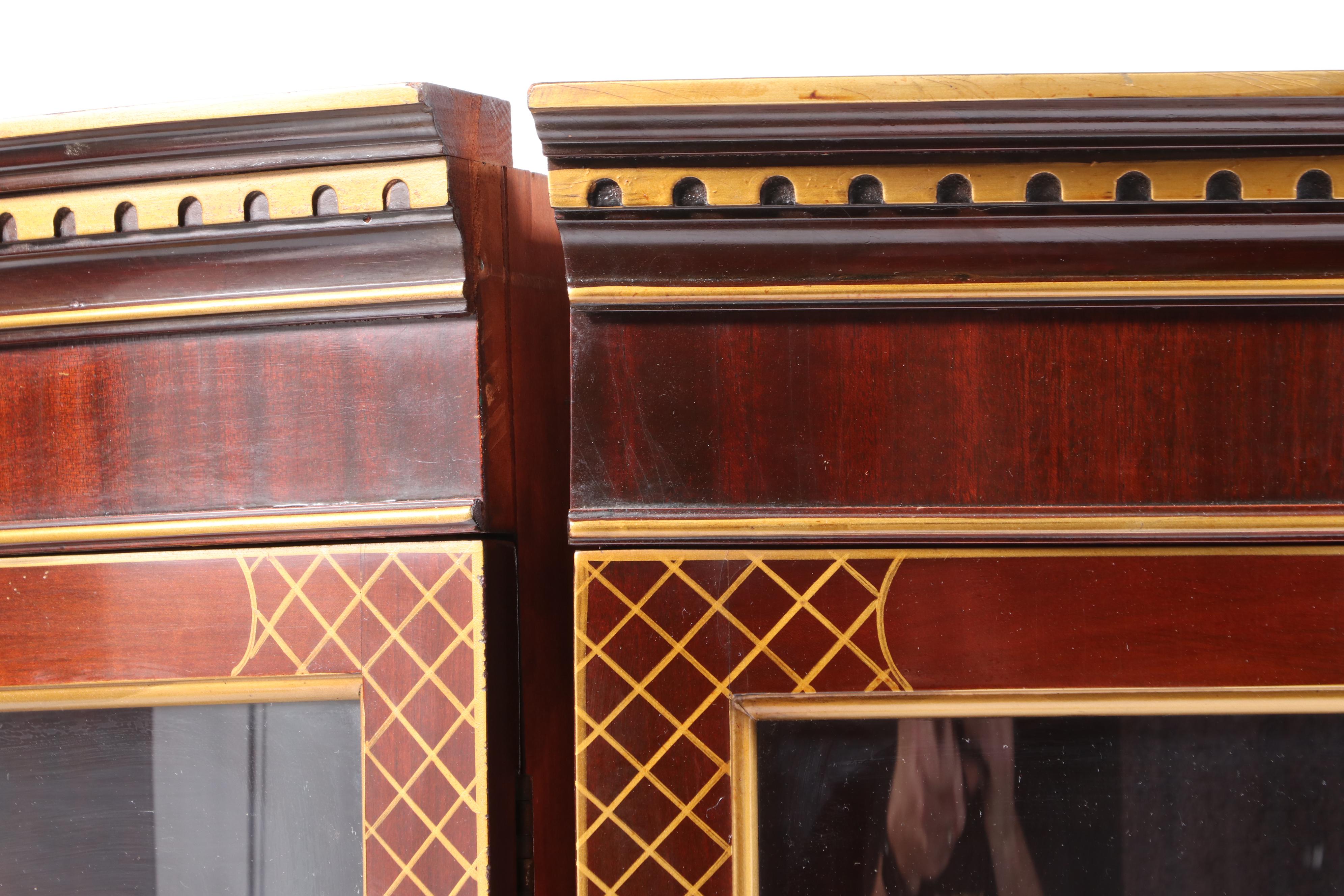 Pair of Parcel-Gilt and Mahogany Bowfront Display Cabinets