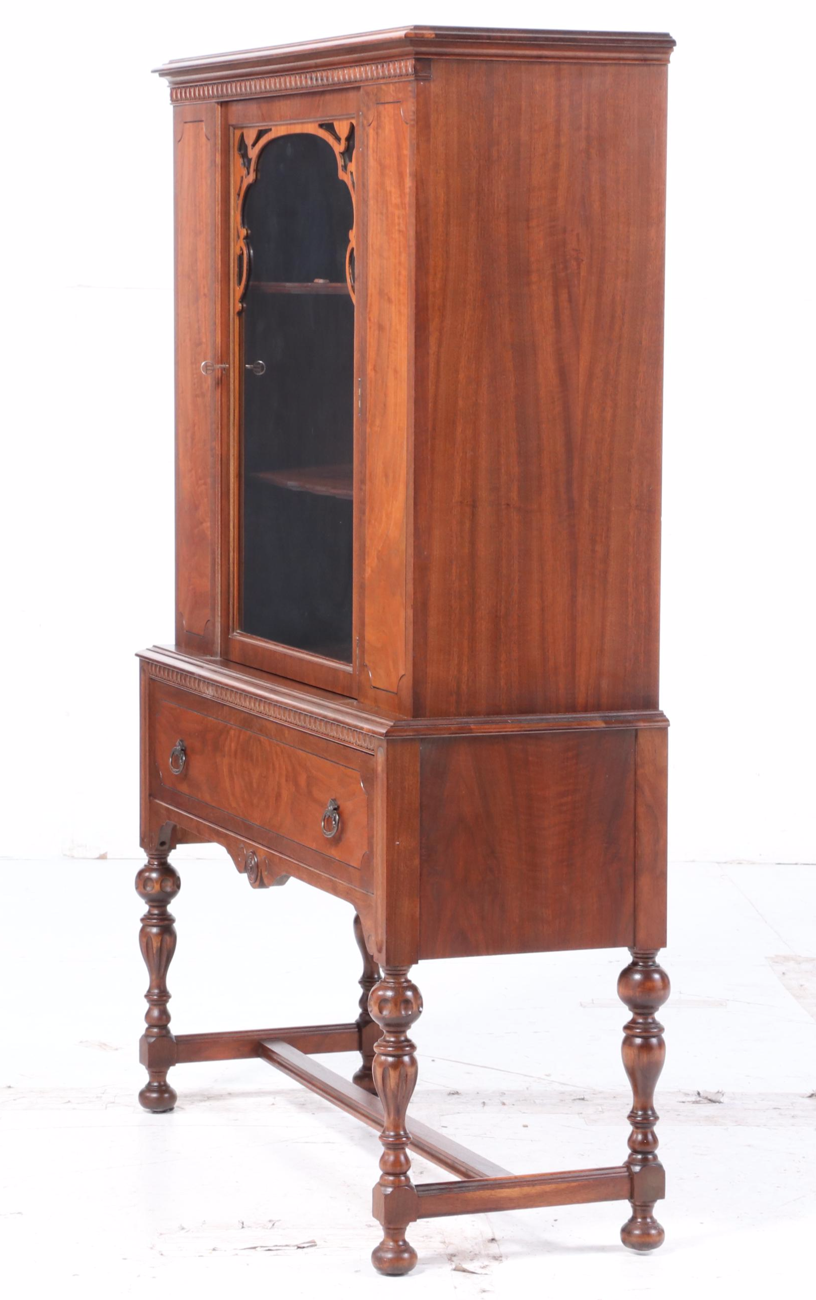 Rockford Furniture Co. Jacobean Style Walnut and Figured Walnut China Cabinet