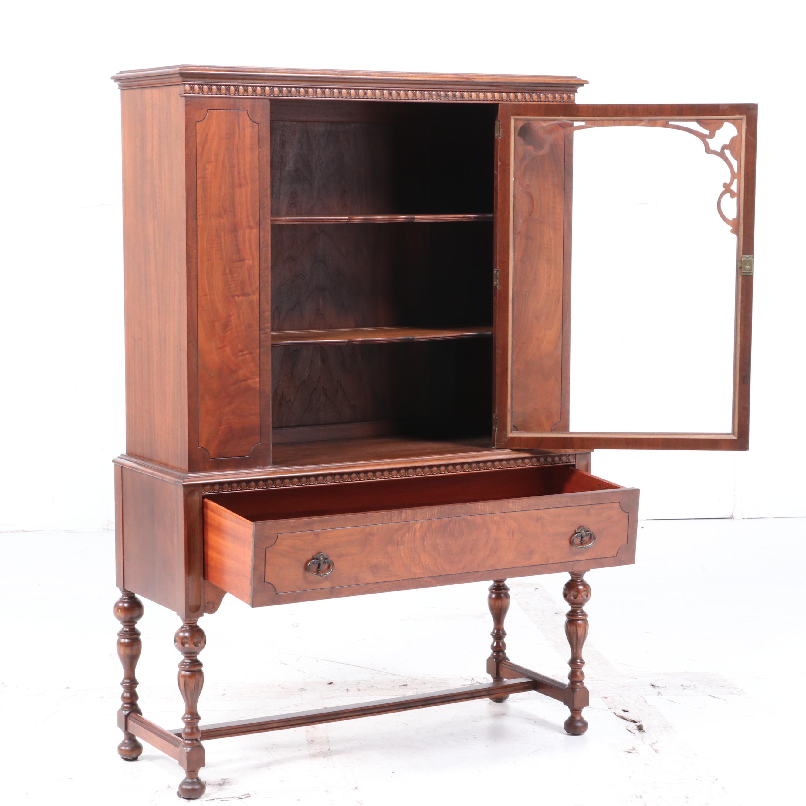 Rockford Furniture Co. Jacobean Style Walnut and Figured Walnut China Cabinet