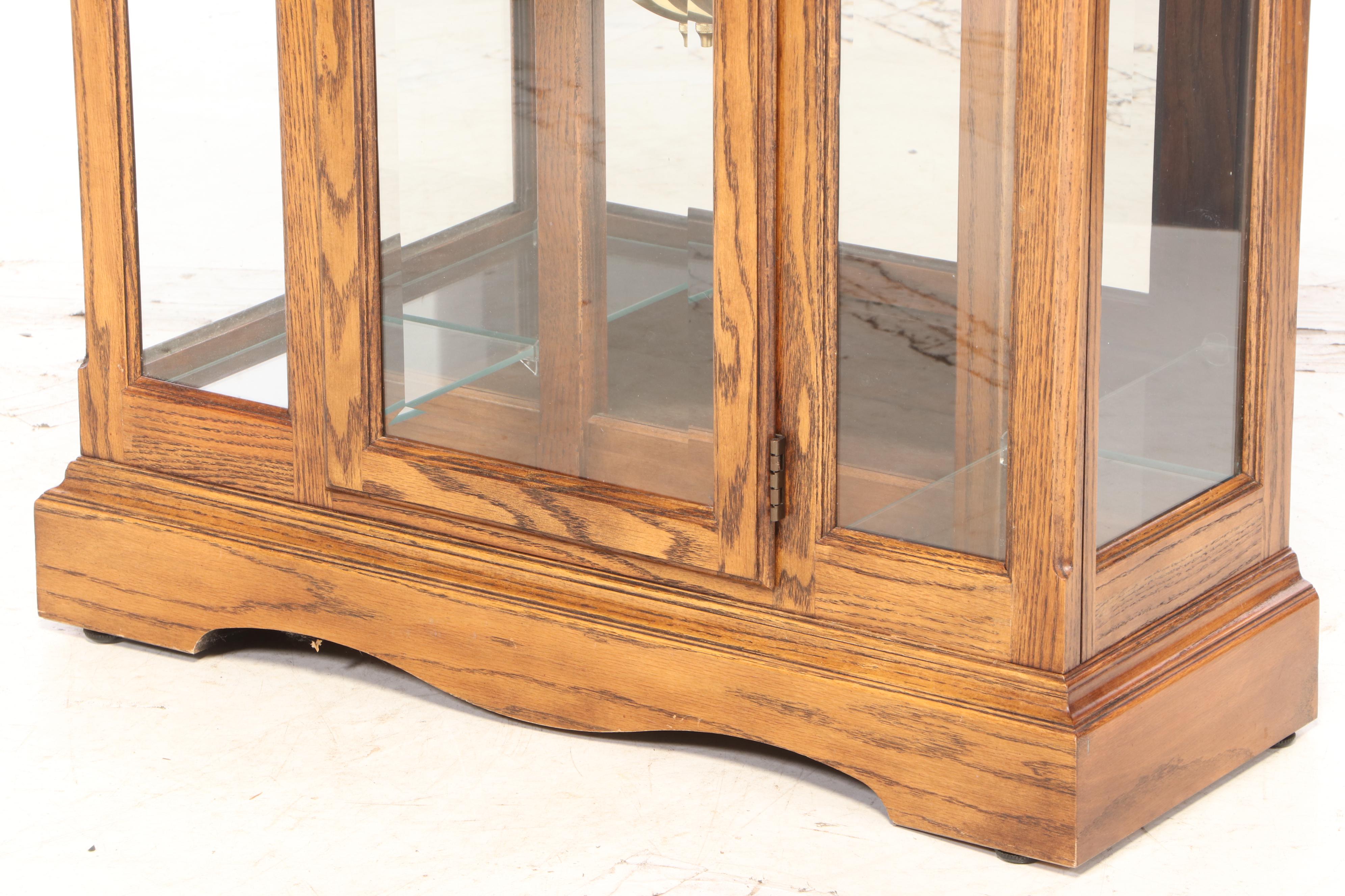 Howard Miller Oak Curio Grandfather Clock with Sidelights