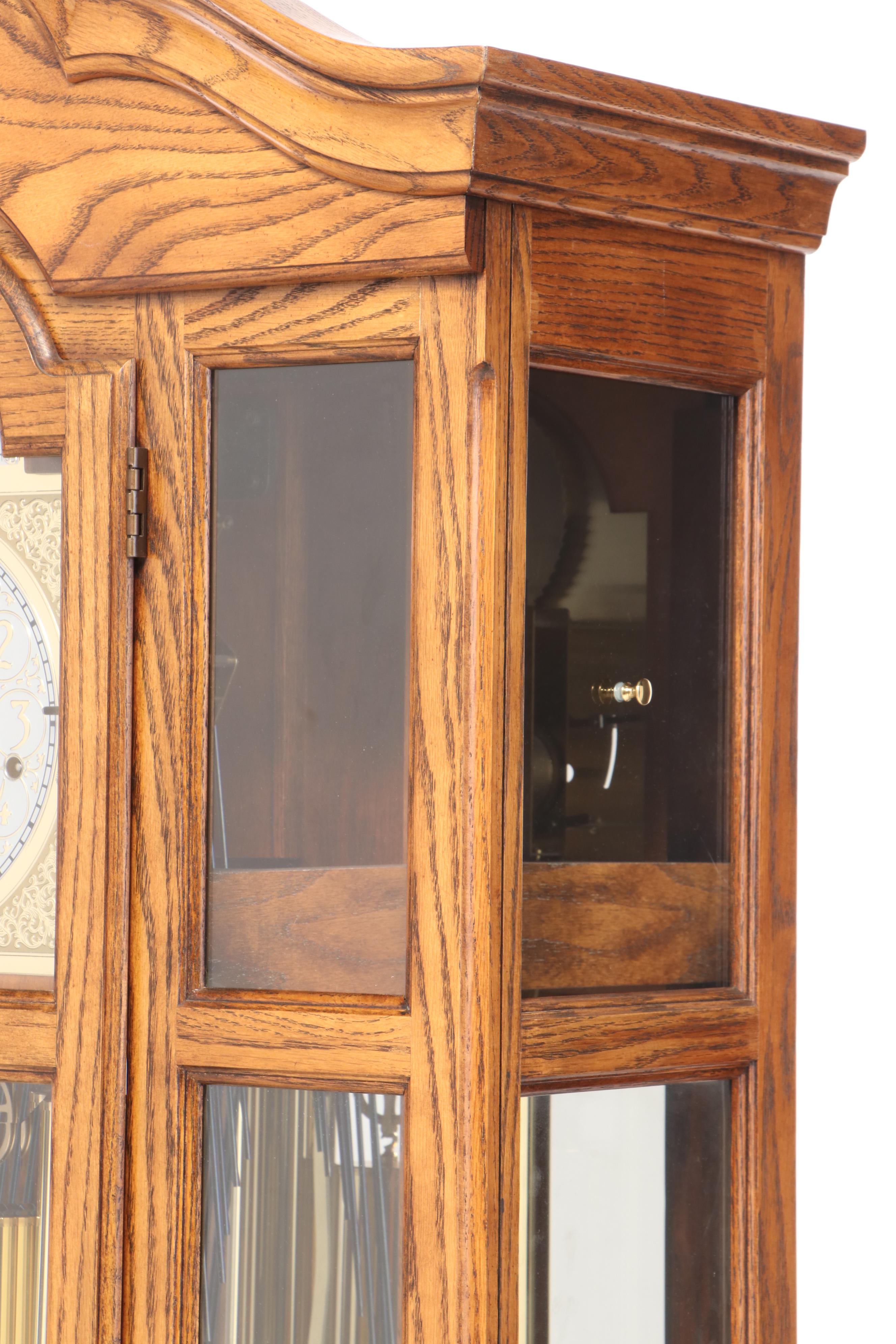 Howard Miller Oak Curio Grandfather Clock with Sidelights
