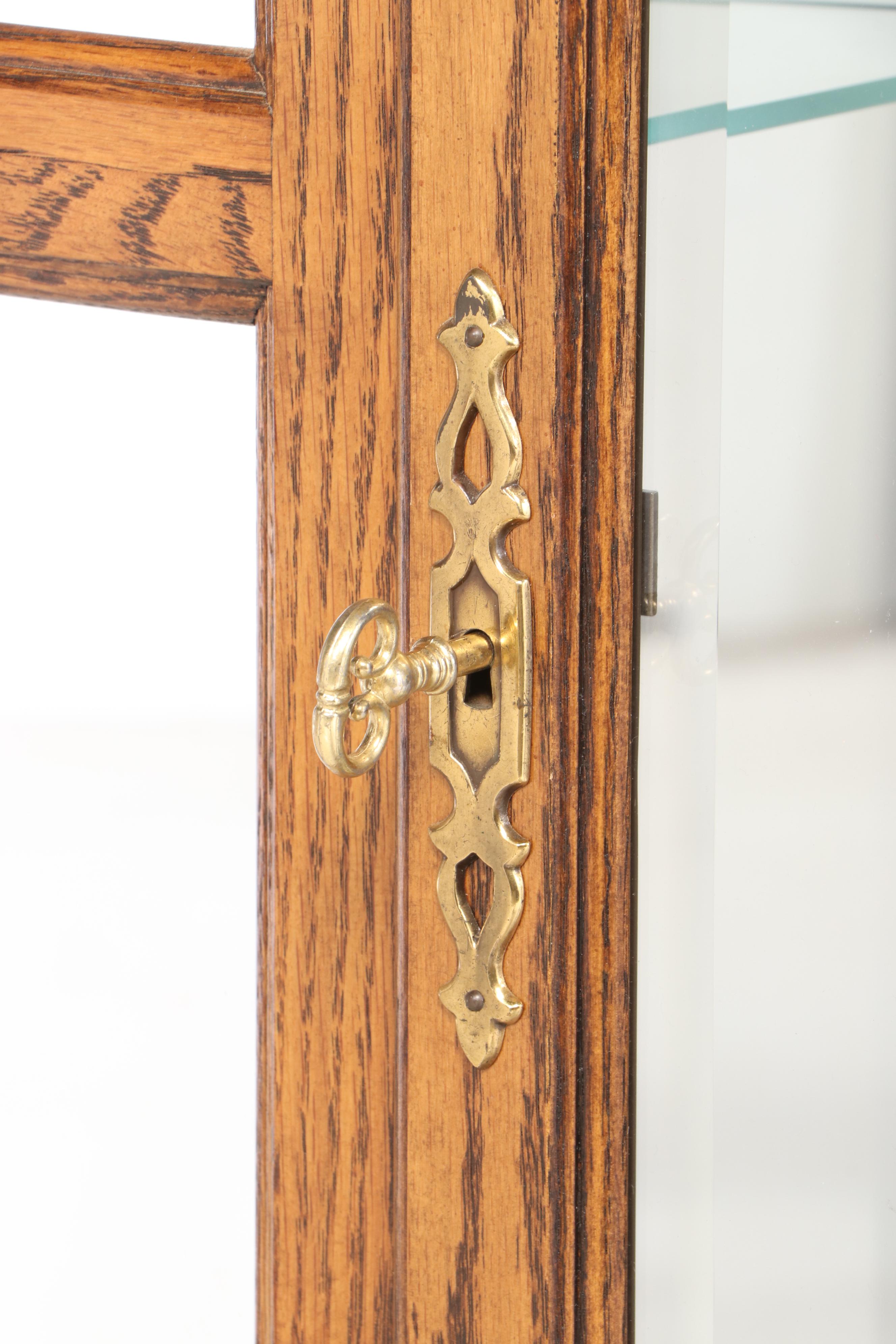 Howard Miller Oak Curio Grandfather Clock with Sidelights