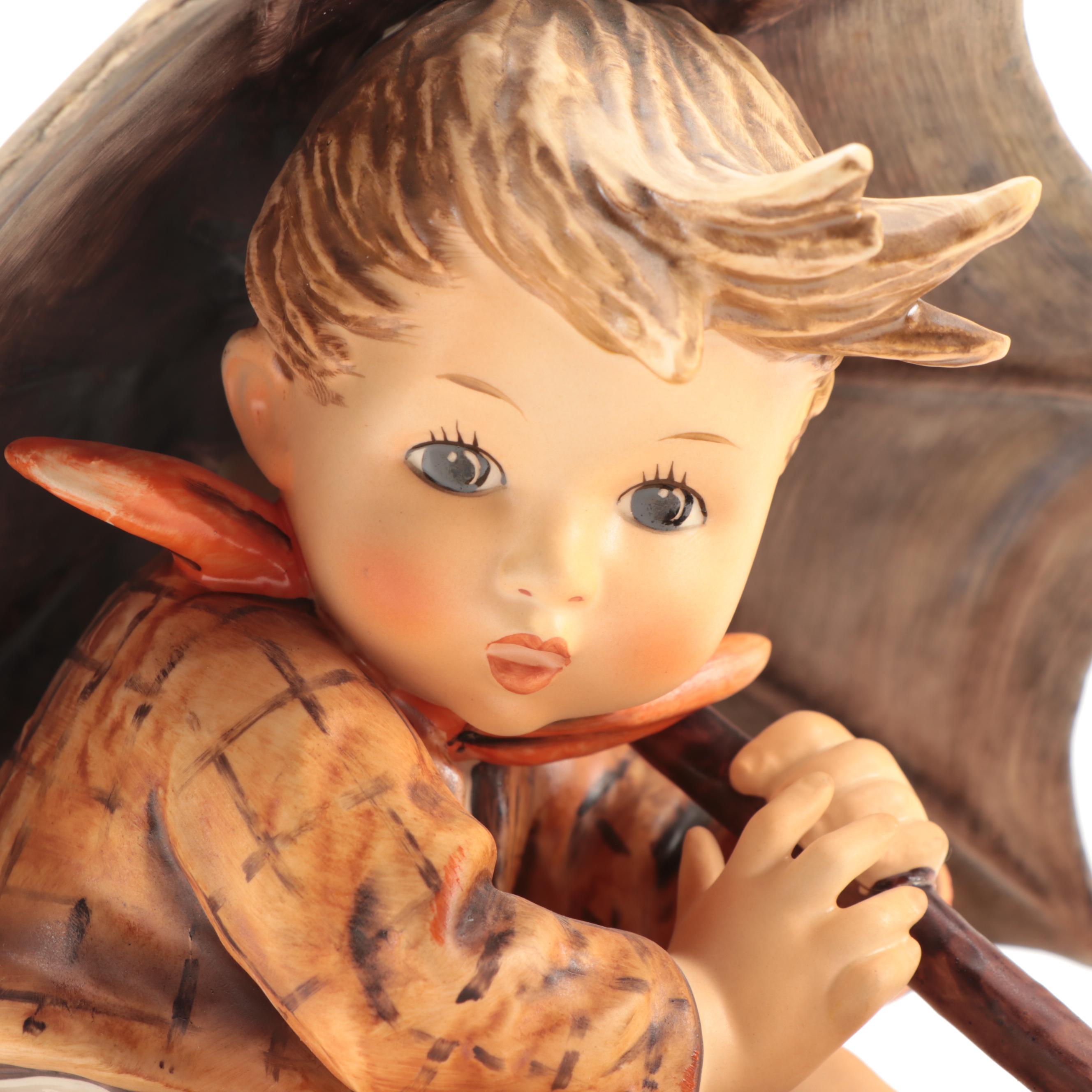 Goebel "Umbrella Girl" and "Umbrella Boy" Porcelain Hummel Figurines