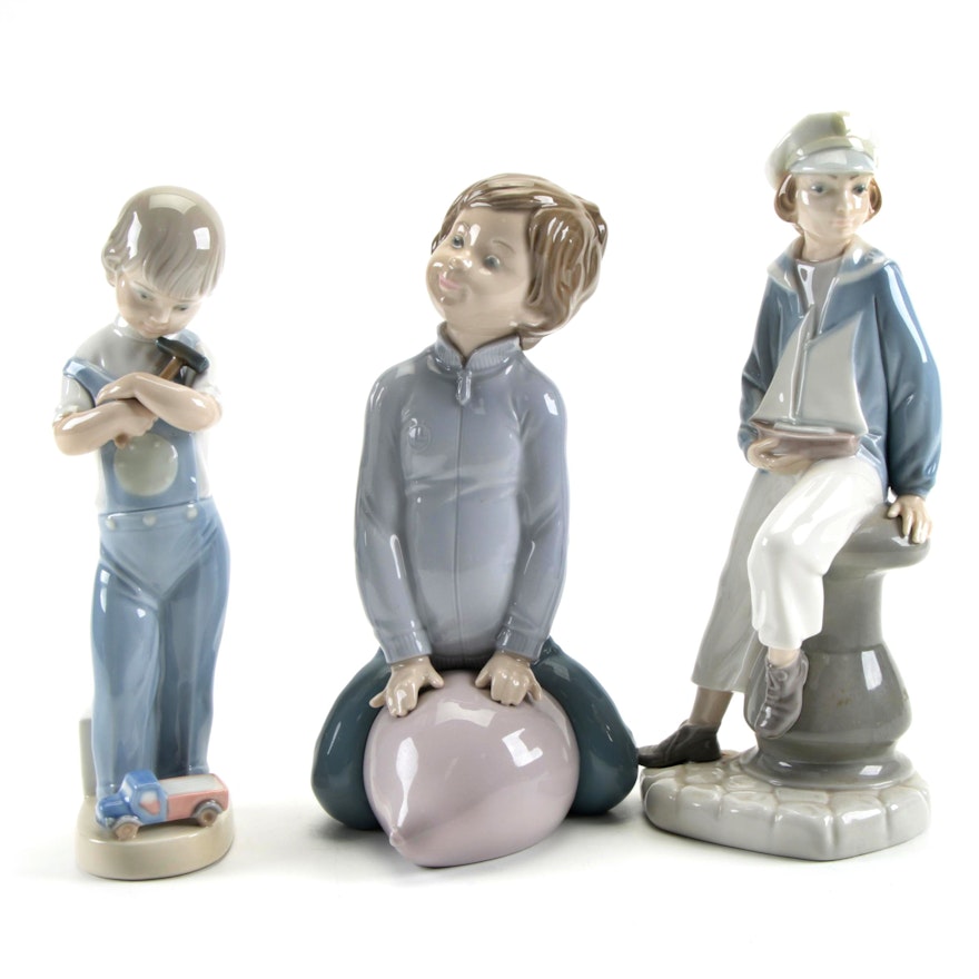 Lladró "Boy with Yacht" and "Mechanic Boy" with Zaphir Porcelain Figurines