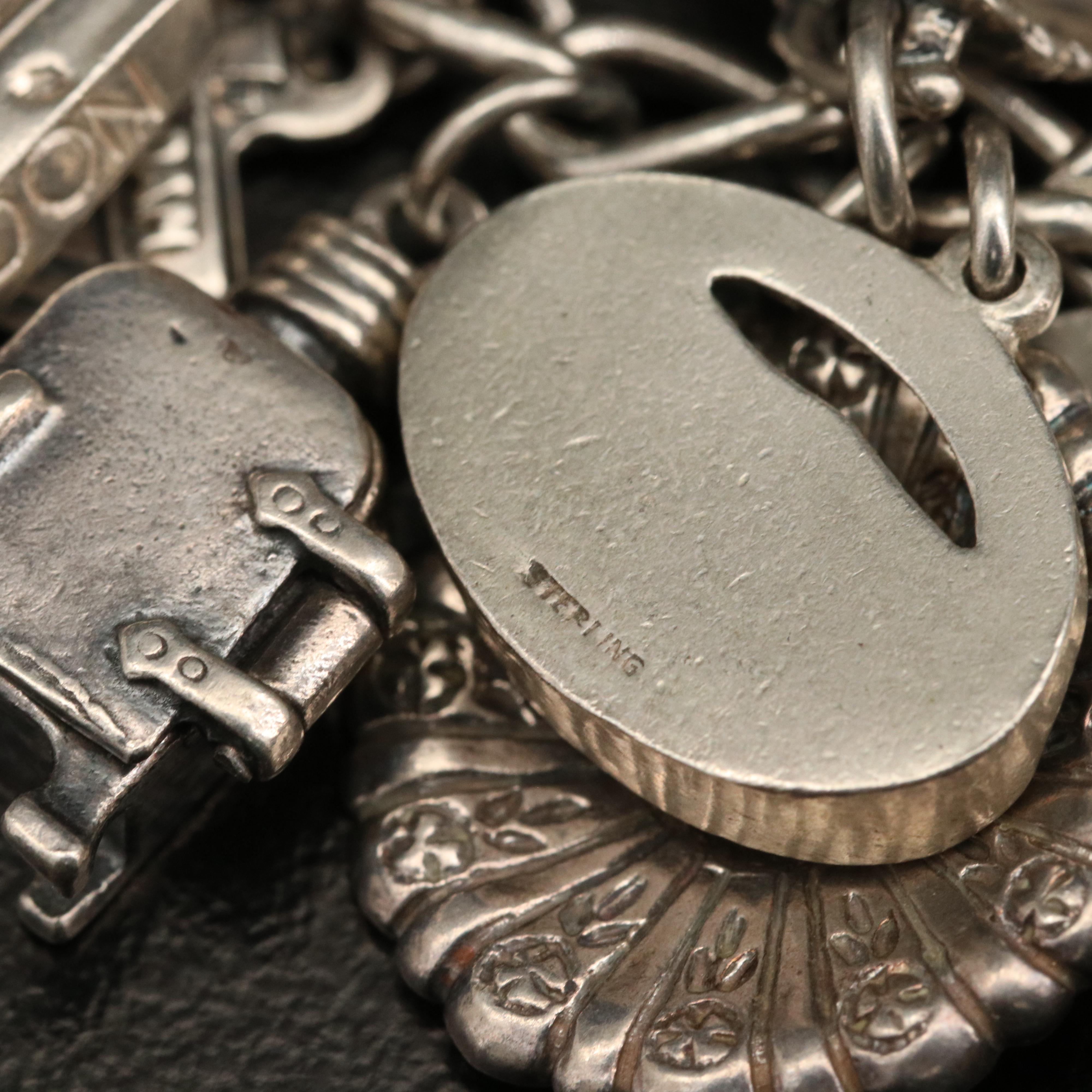 Vintage Sterling Charm Bracelet with Disneyland Castle and Bell Trading Co.