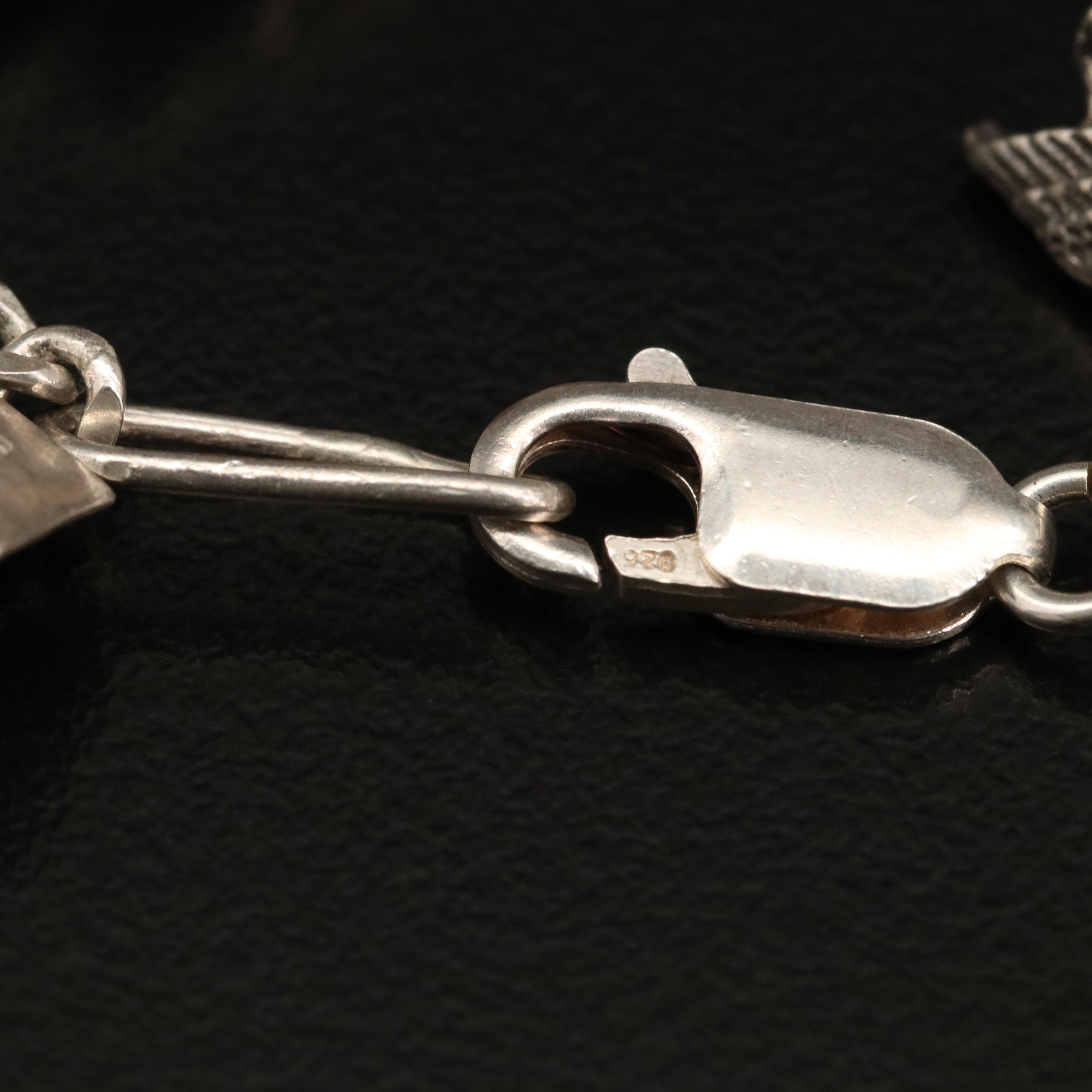 Vintage Sterling Charm Bracelet with Disneyland Castle and Bell Trading Co.