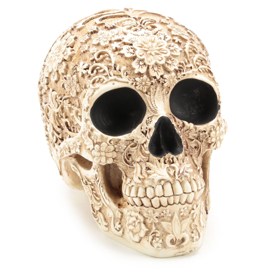 Carved Resin Skull Figurine With Floral Motif