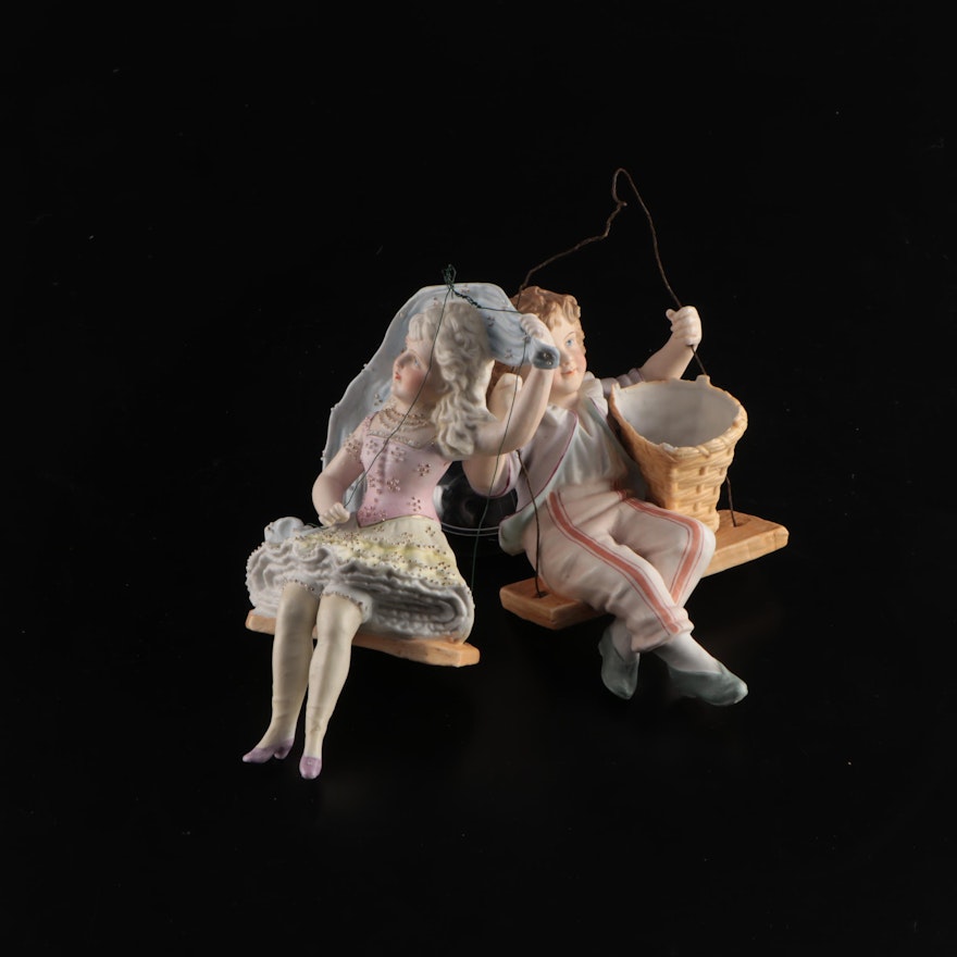 Ceramic Boy and Girl in Swings Figurines